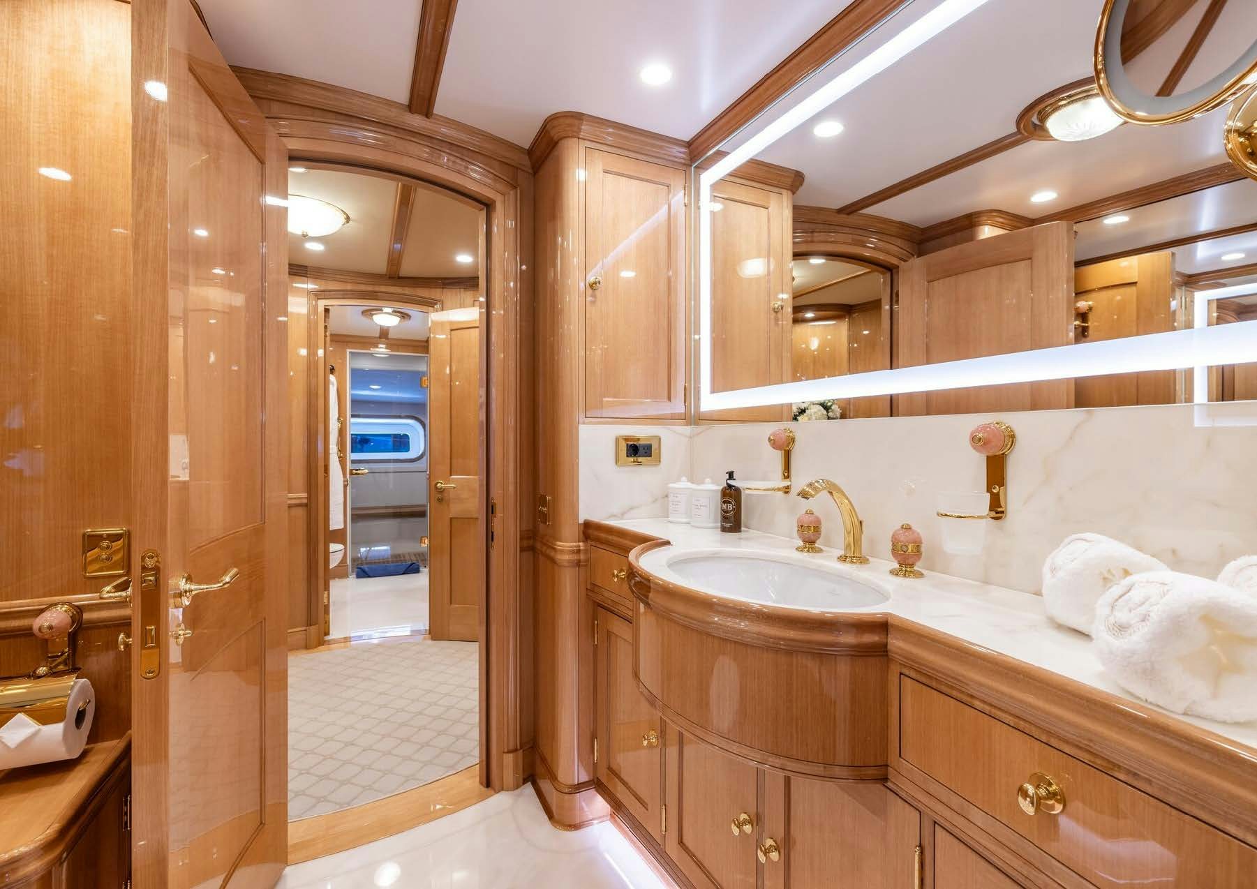 a bathroom with a large mirror aboard MAXIMUS Yacht for Charter