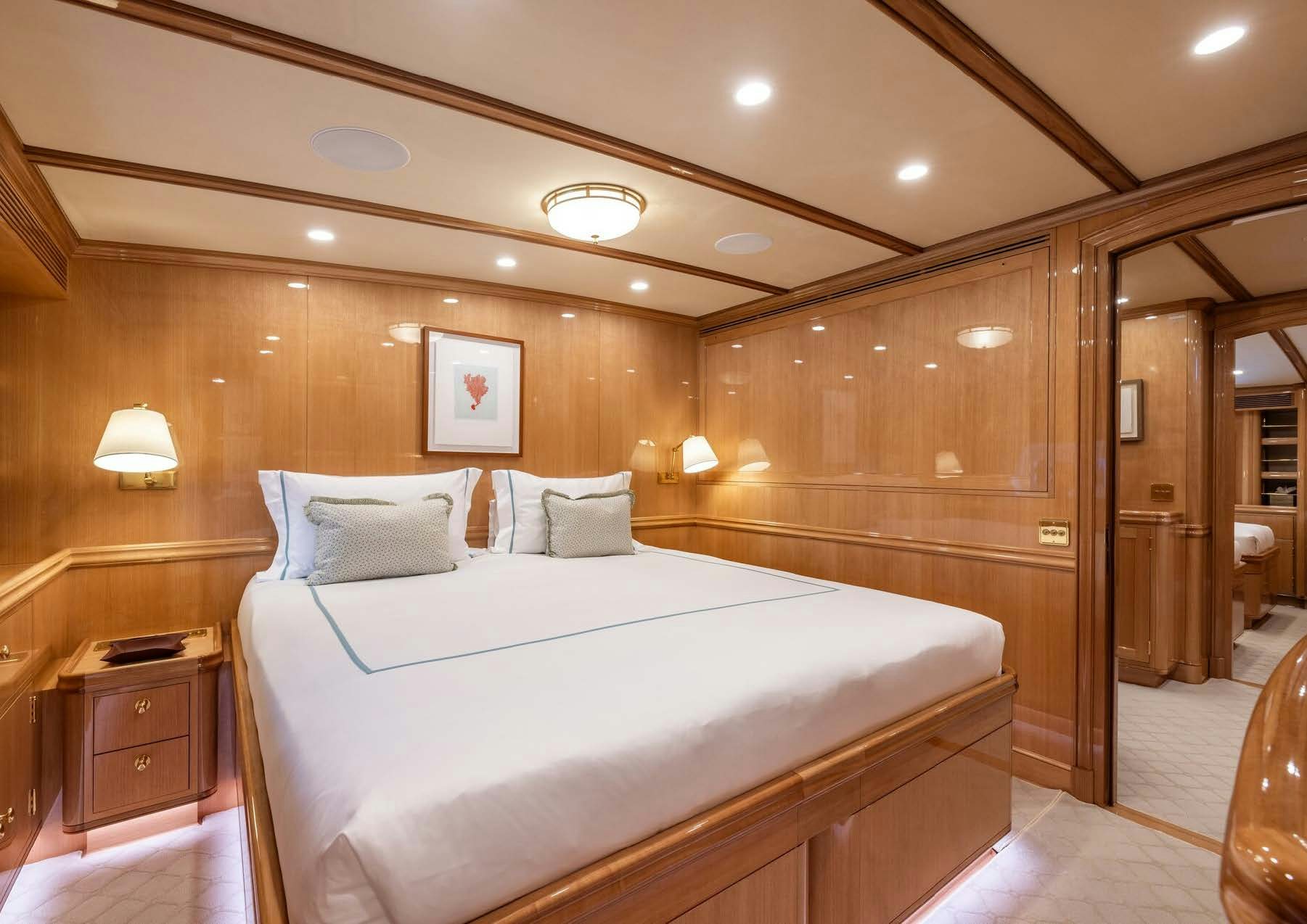 a large bed in a room aboard MAXIMUS Yacht for Charter