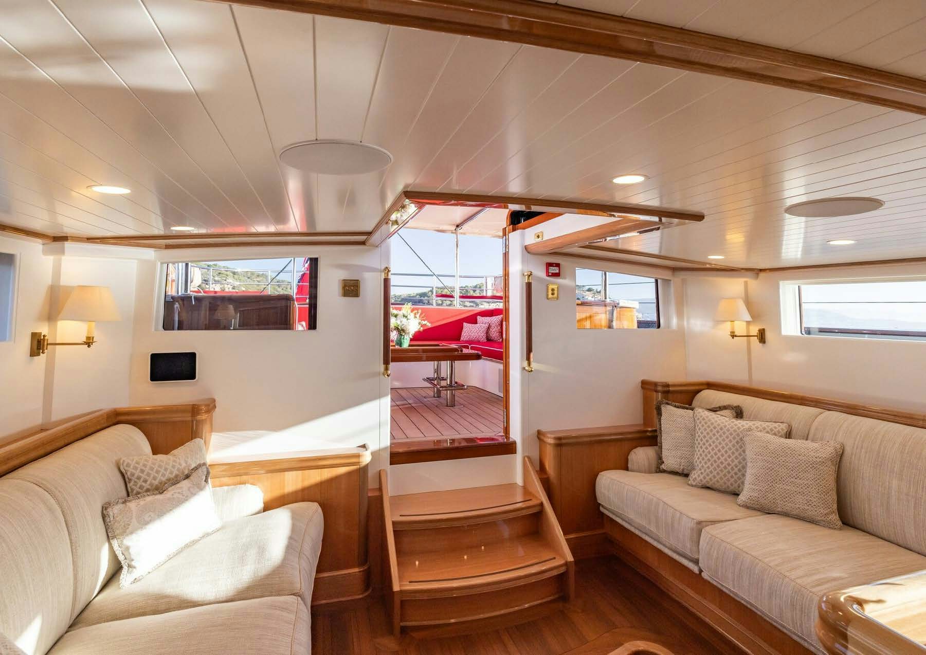 a room with a bed and a couch aboard MAXIMUS Yacht for Charter
