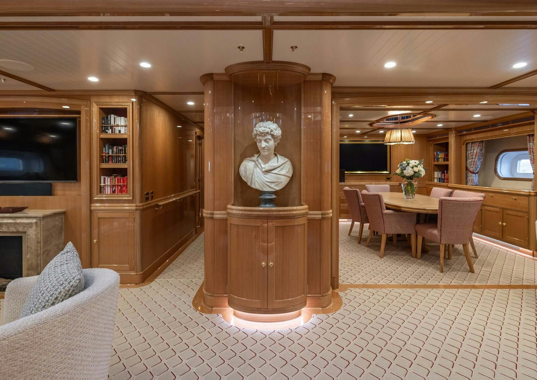 a large wooden statue in a room aboard MAXIMUS Yacht for Charter