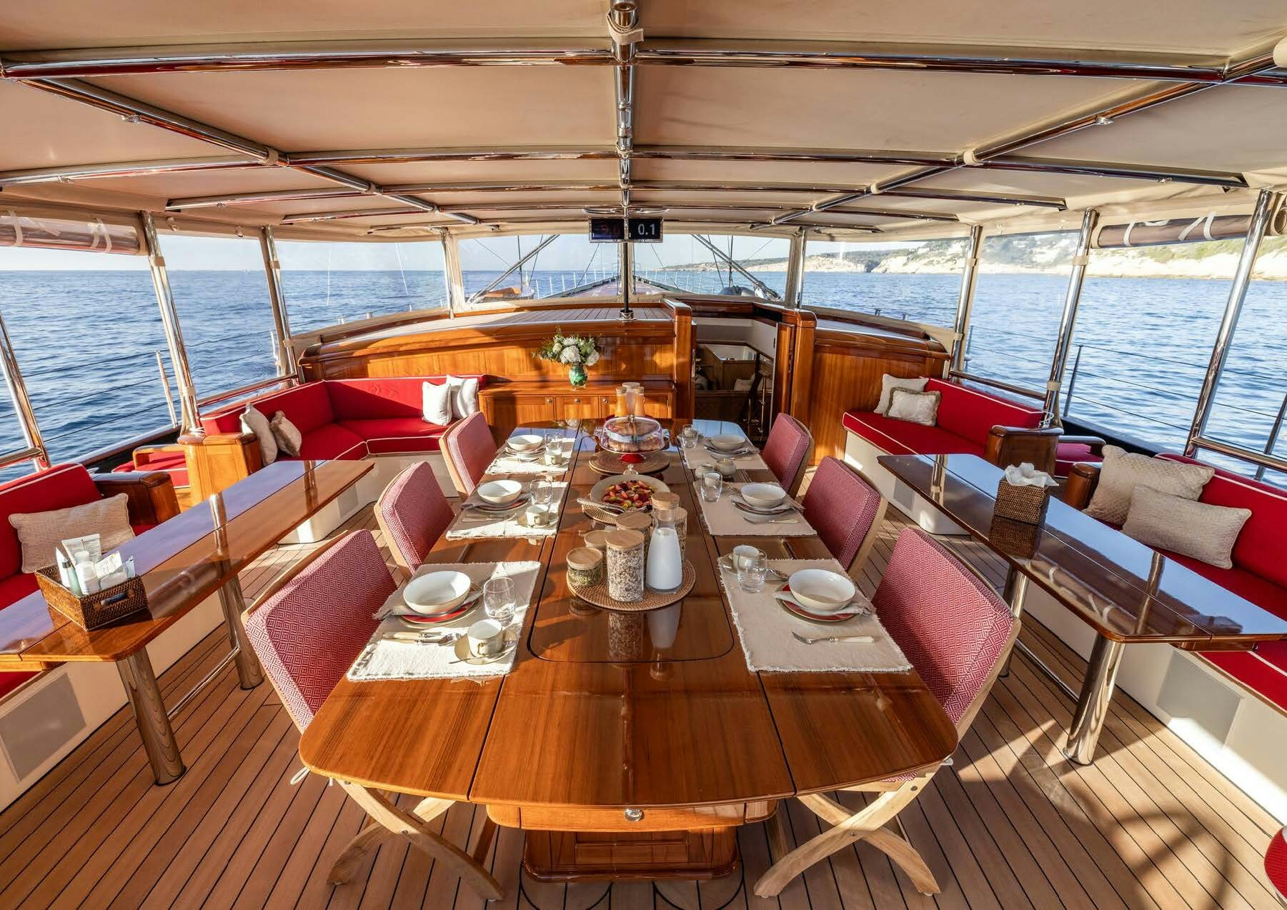 a restaurant with tables and chairs aboard MAXIMUS Yacht for Charter