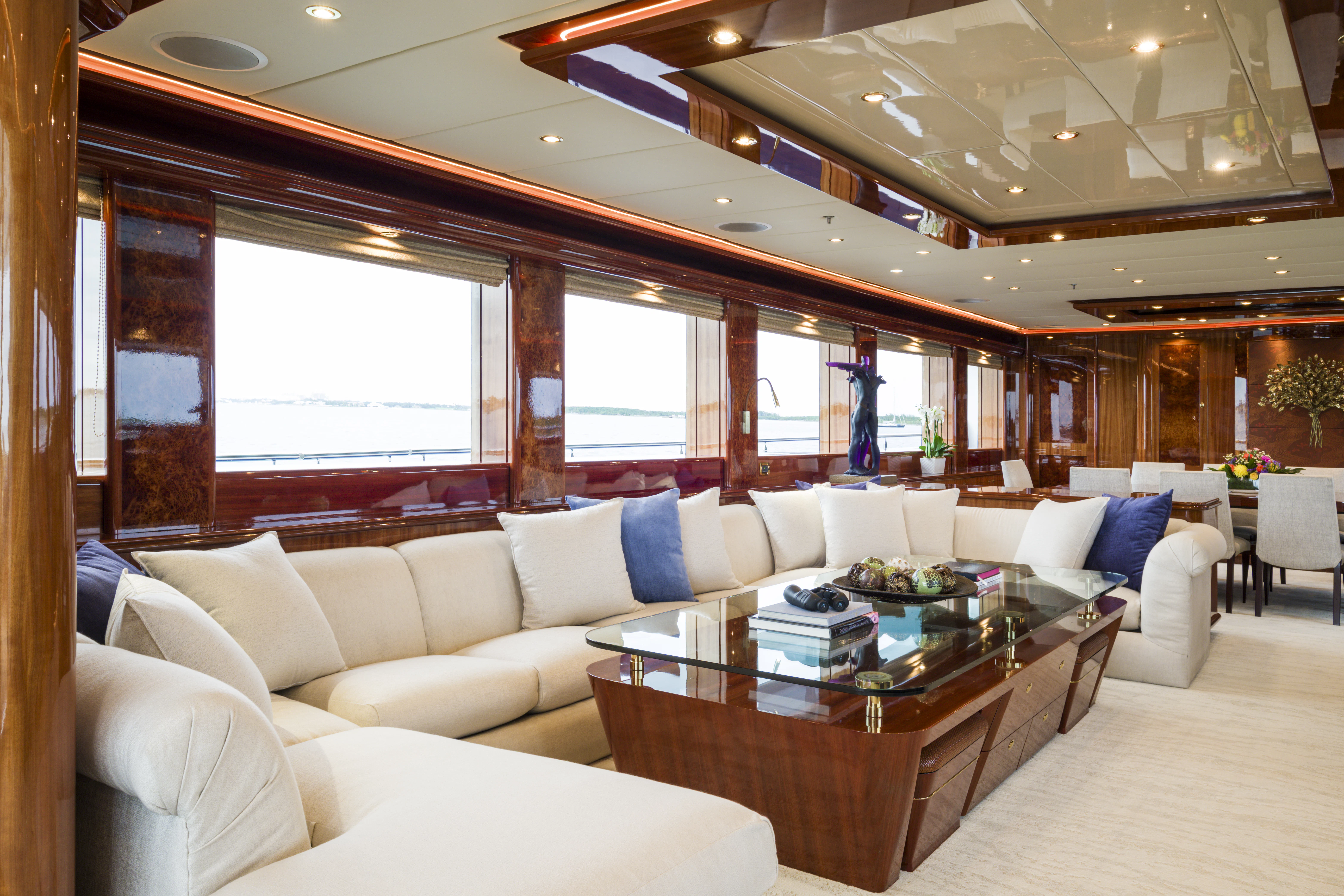 a living room with a large window aboard DUCHESS Yacht for Sale