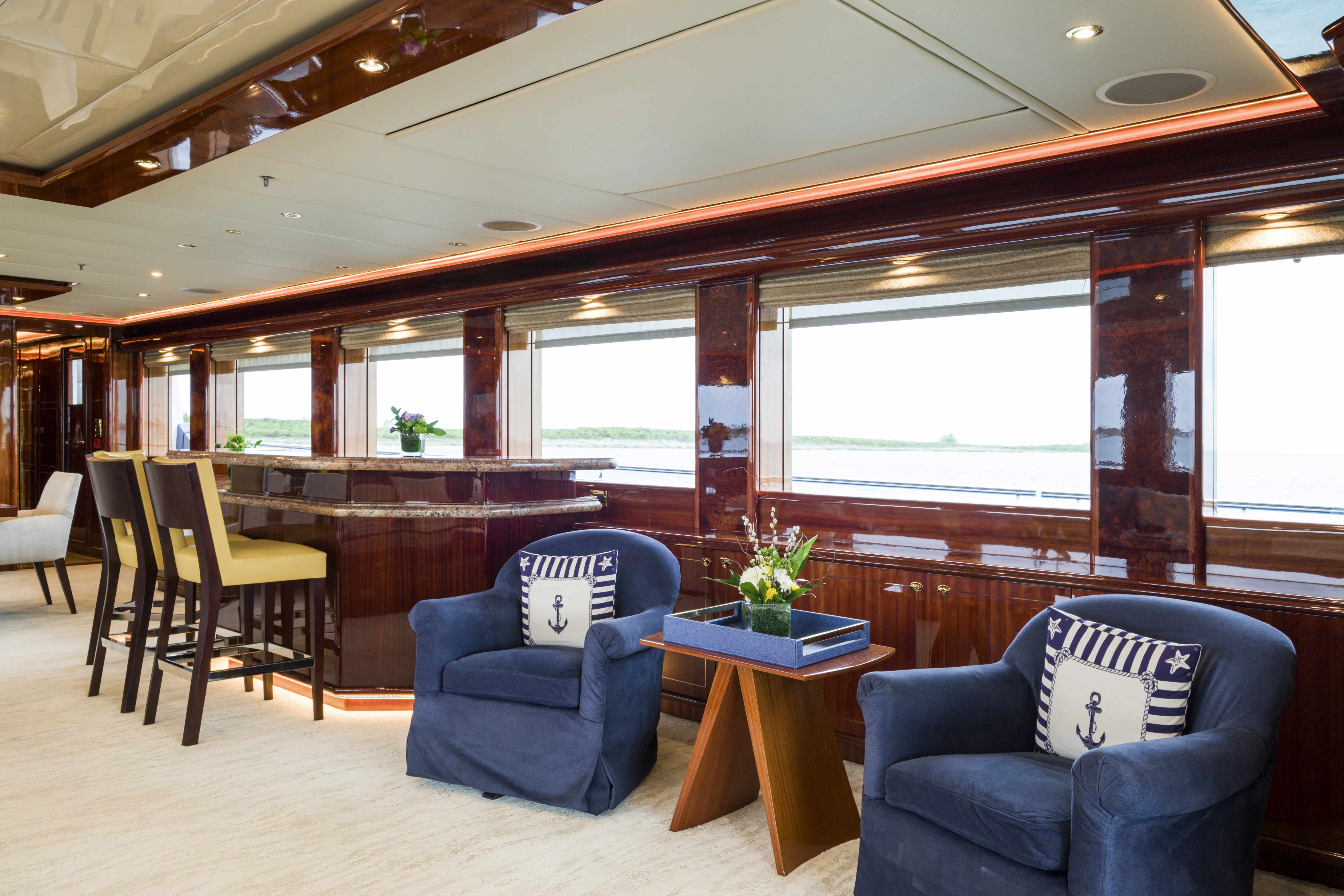 a room with a table chairs and a window aboard DUCHESS Yacht for Sale