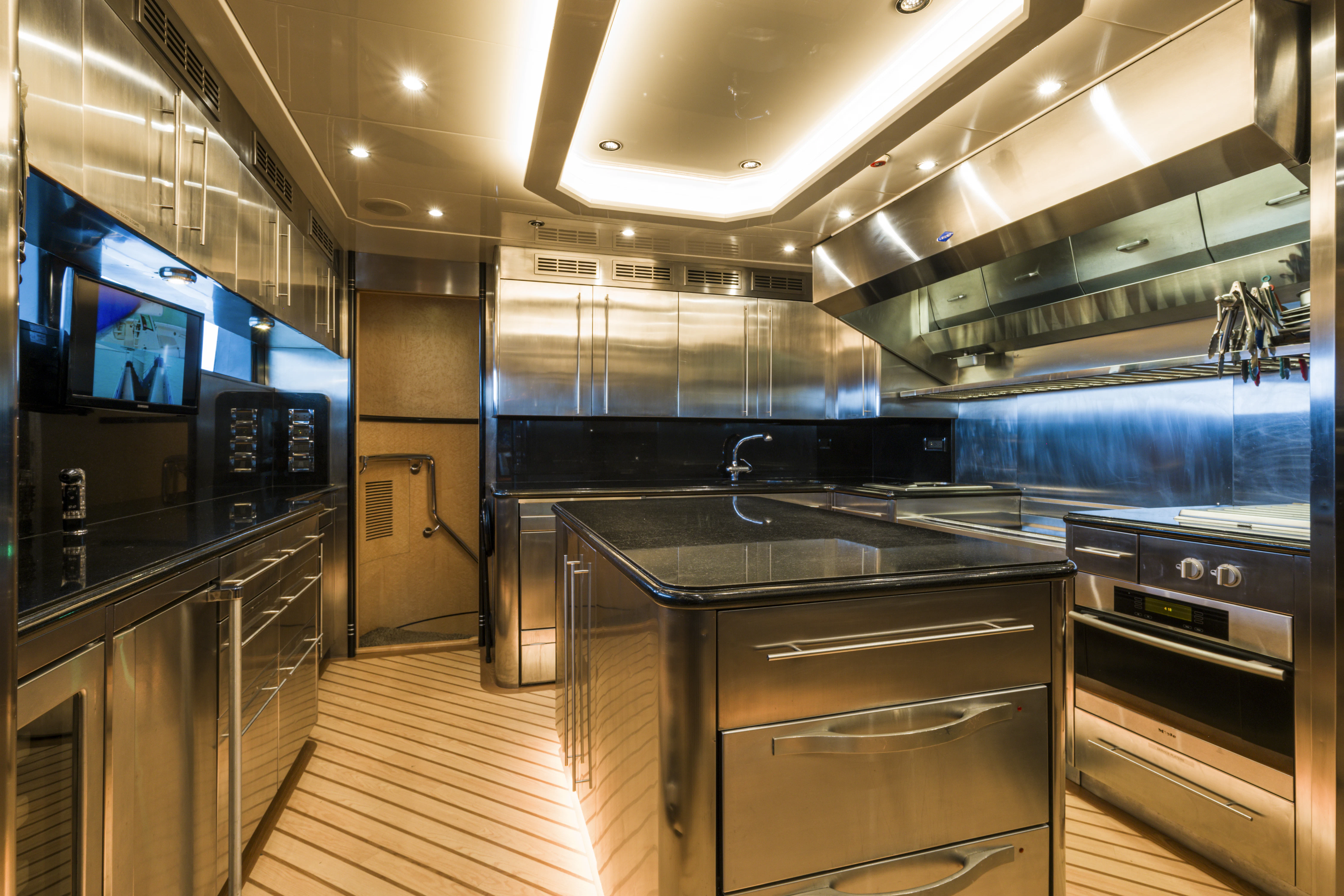 a kitchen with stainless steel appliances aboard DUCHESS Yacht for Sale