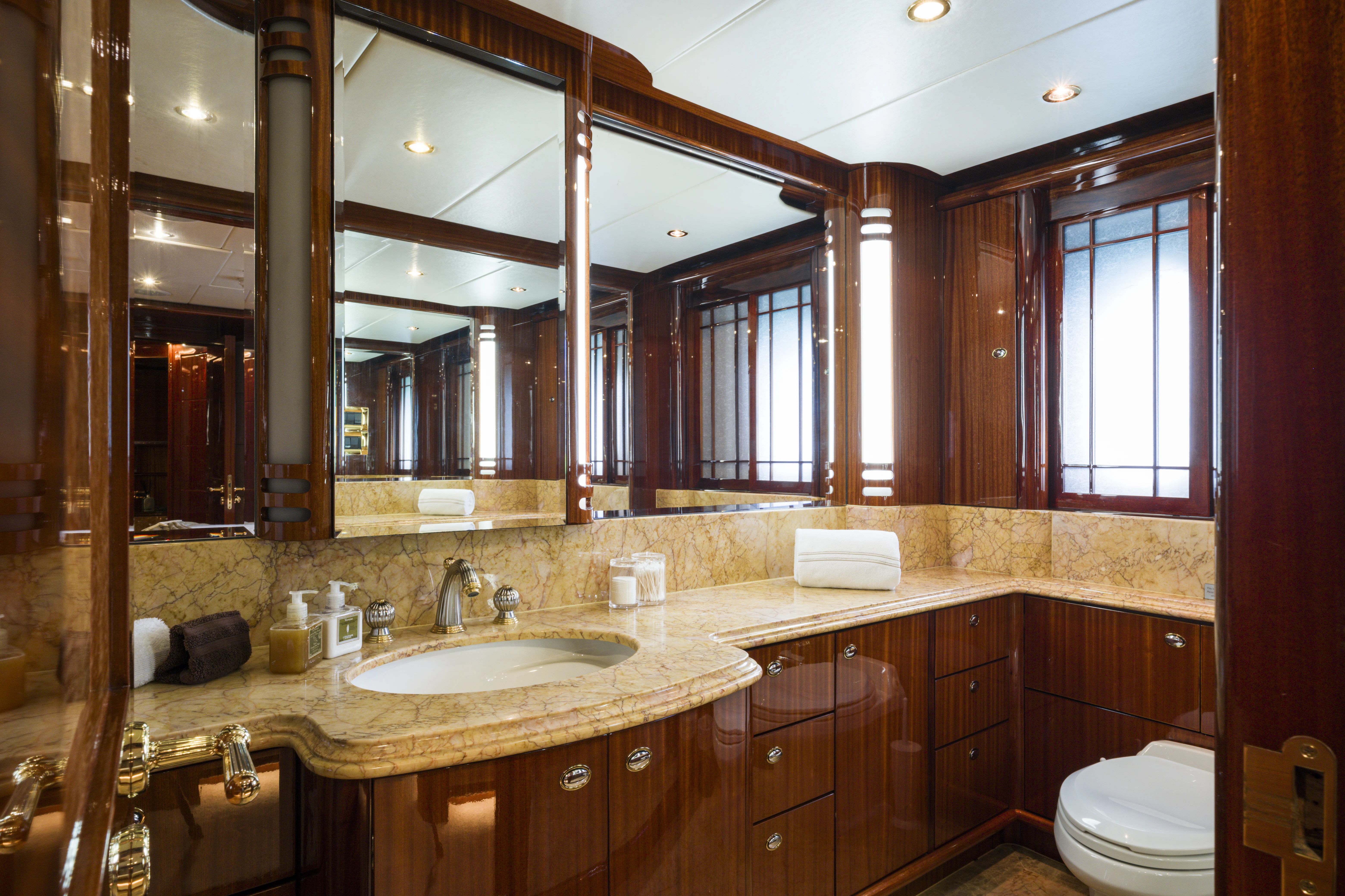 a bathroom with a large mirror aboard DUCHESS Yacht for Sale