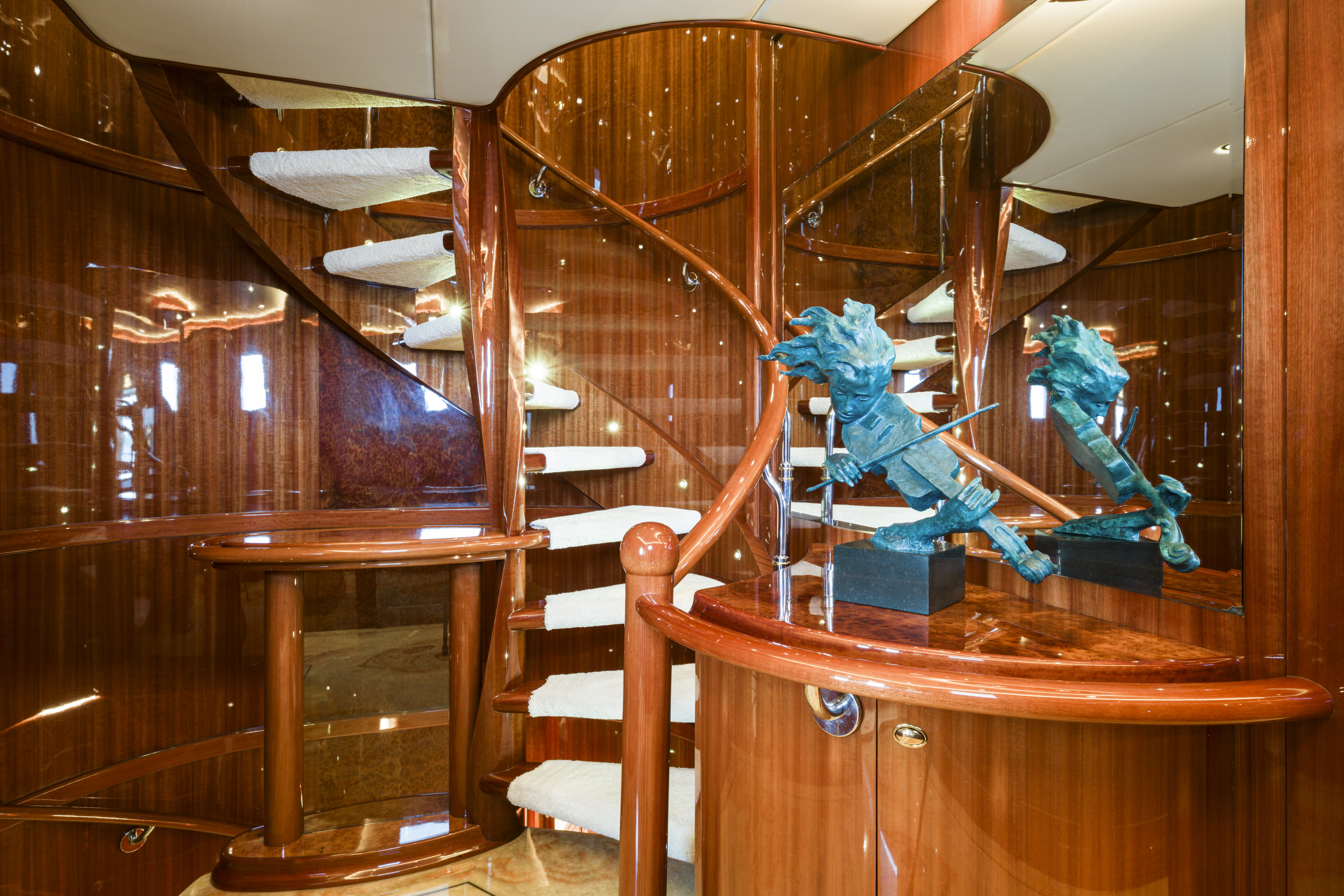 a couple of blue dragon statues on a wooden table aboard DUCHESS Yacht for Sale