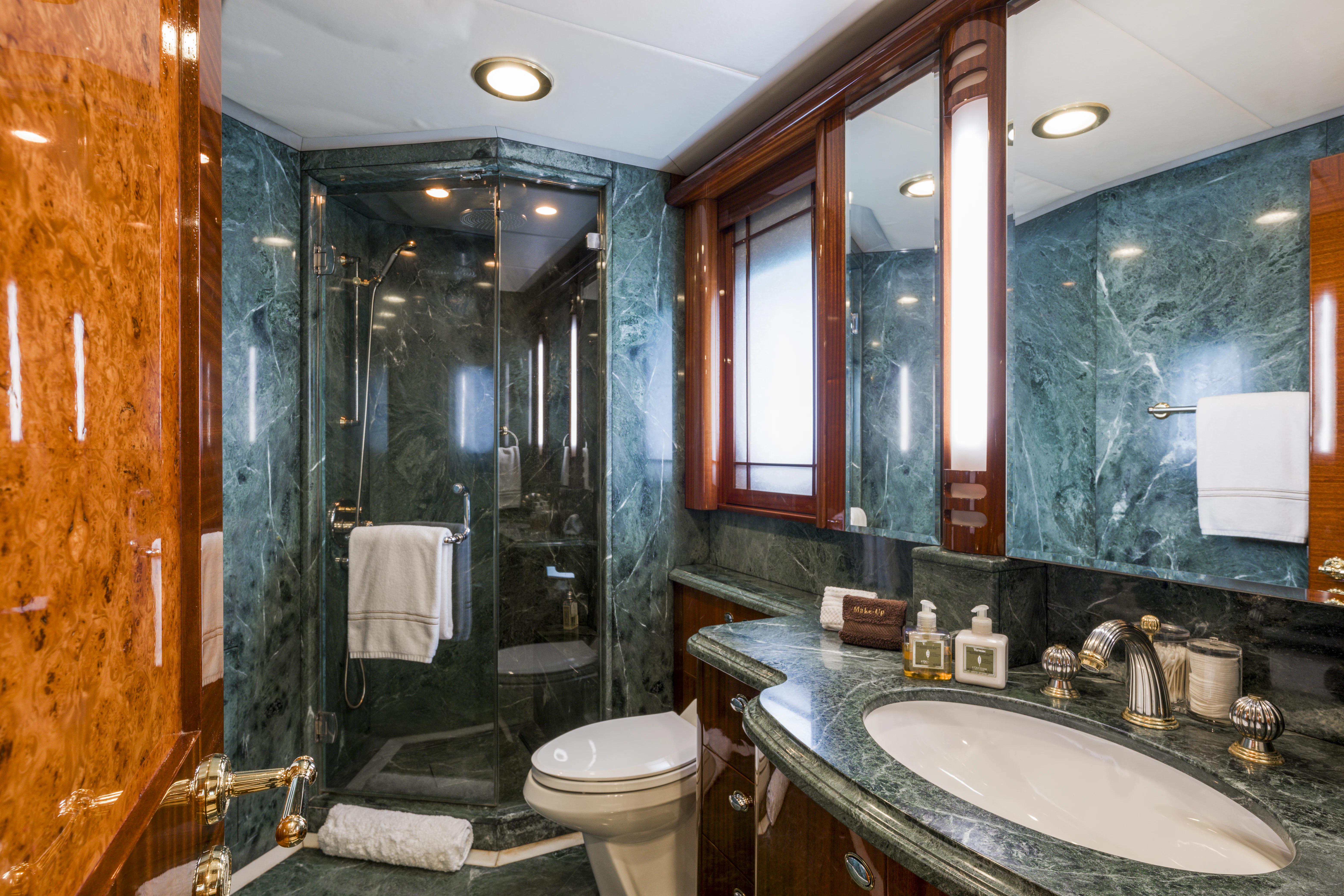 a bathroom with a glass shower aboard DUCHESS Yacht for Sale