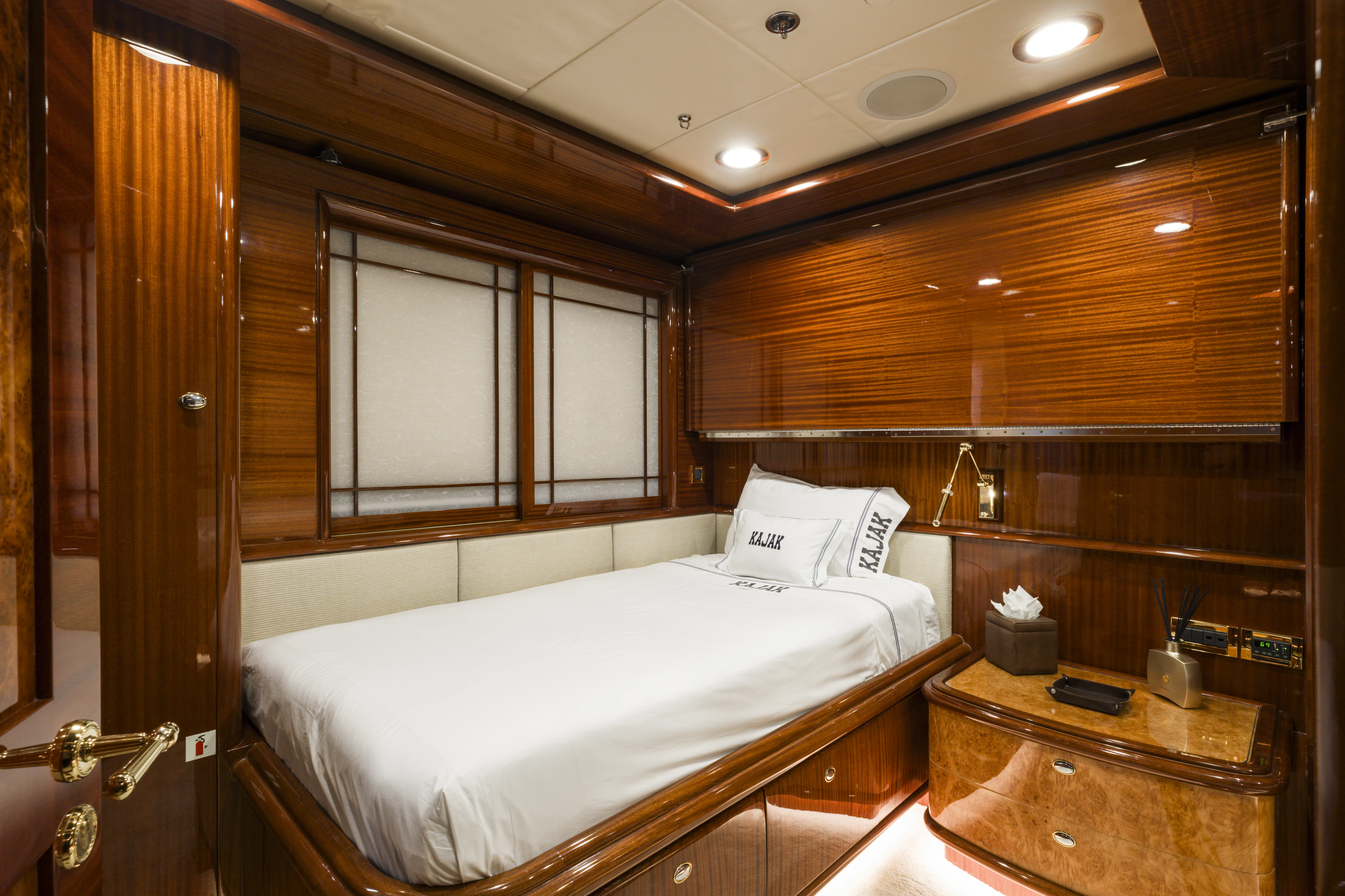 a bedroom with a bed and a closet aboard DUCHESS Yacht for Sale