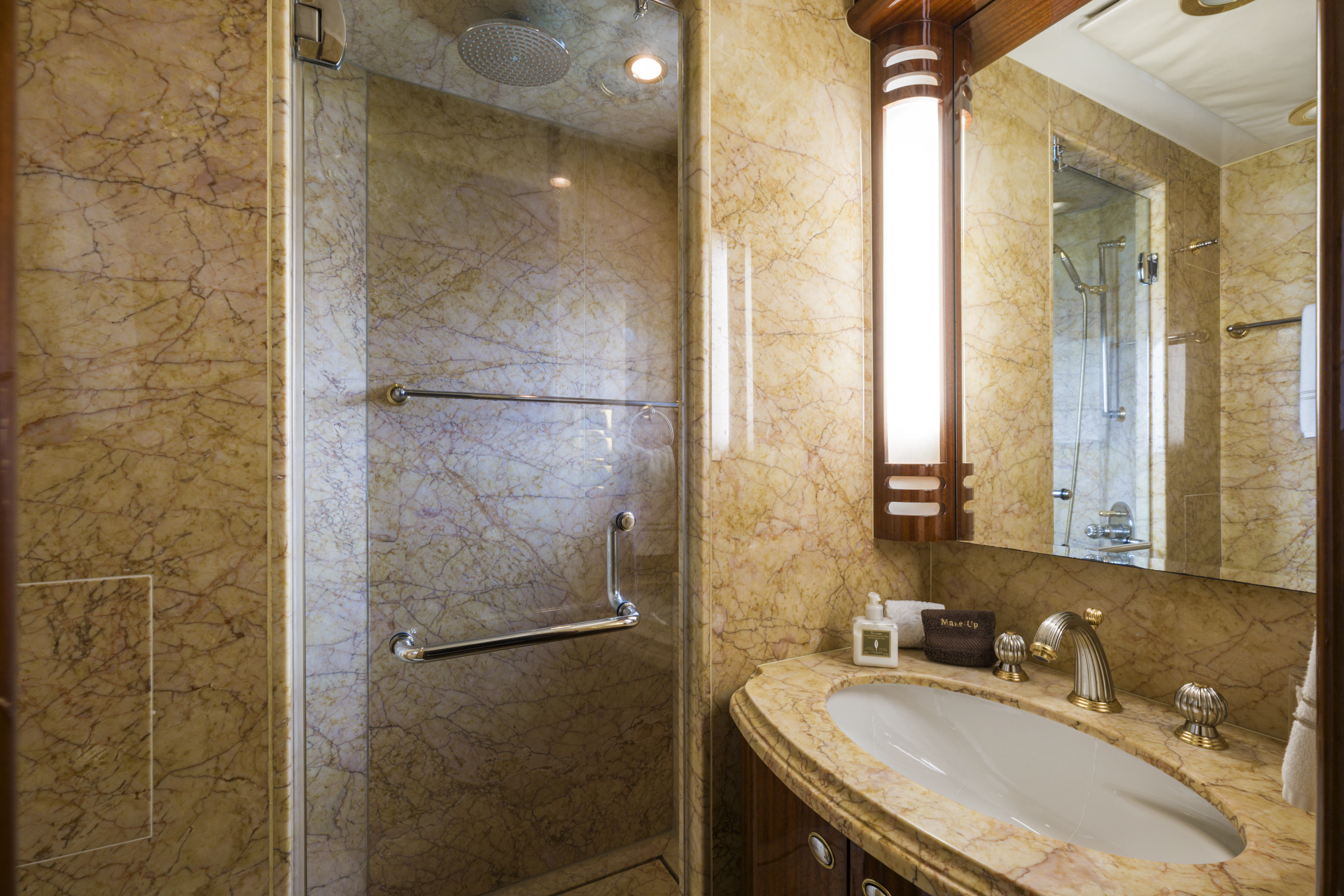 a bathroom with a glass shower aboard DUCHESS Yacht for Sale