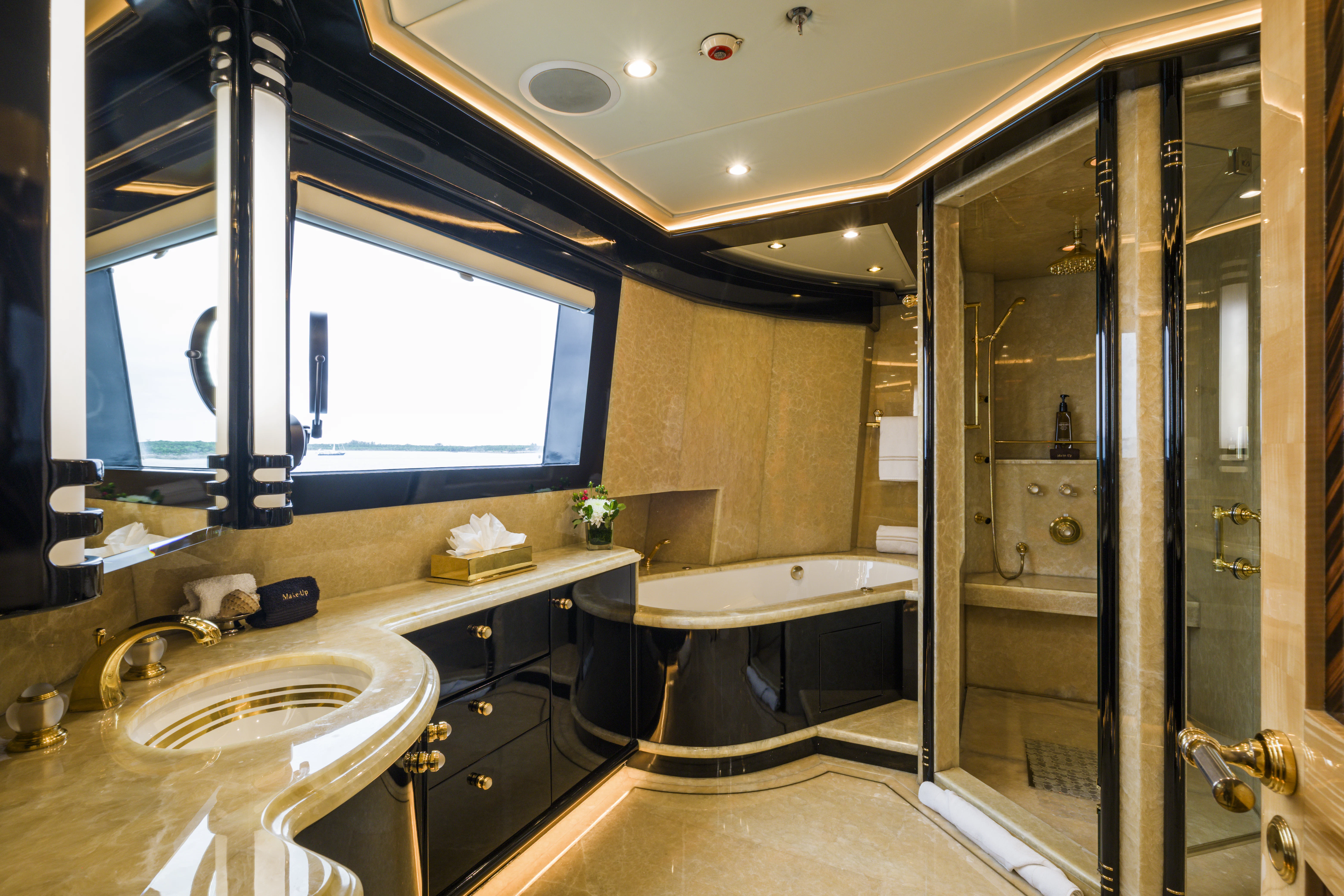 a bathroom with a large glass shower aboard DUCHESS Yacht for Sale