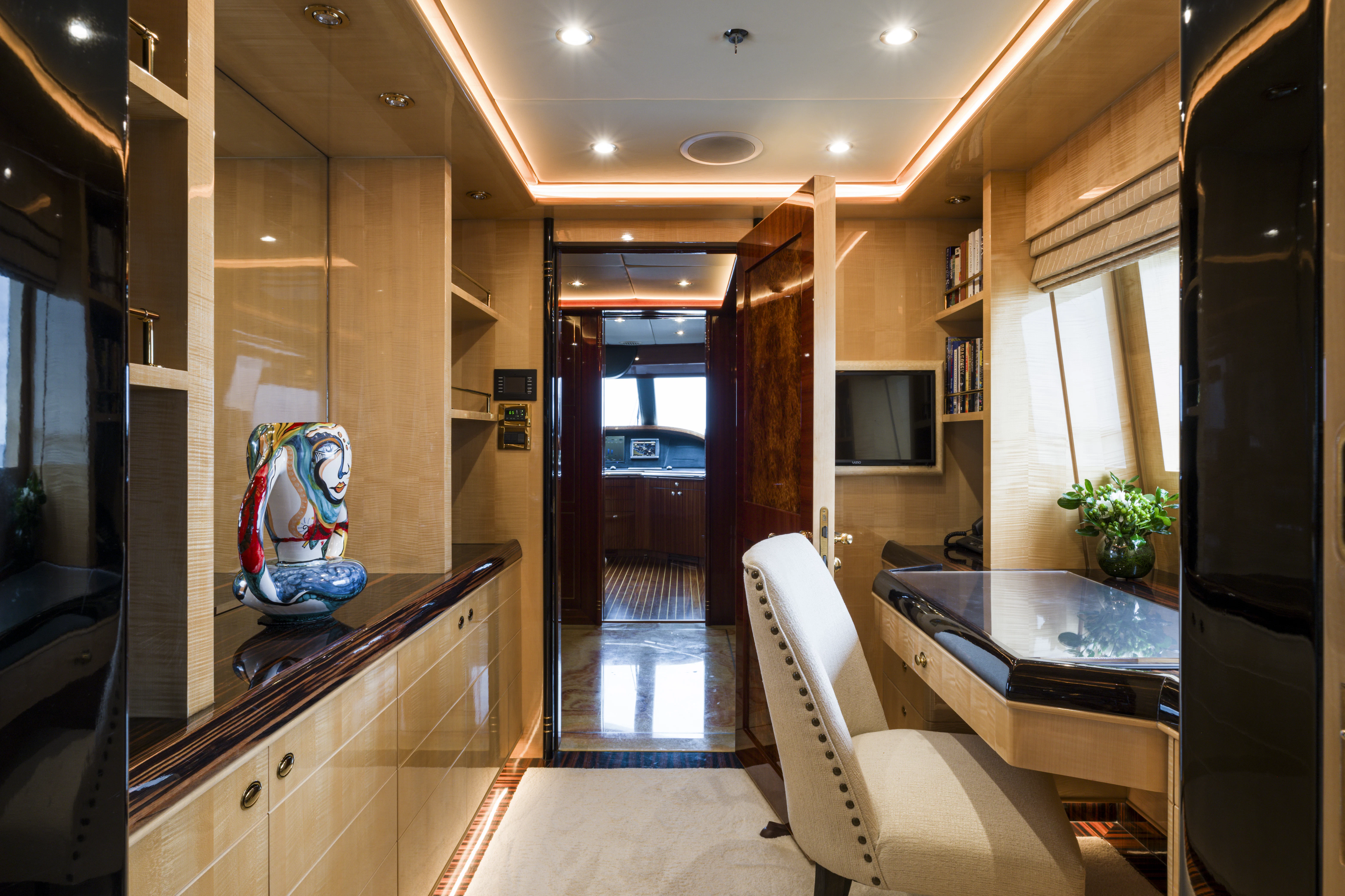 a kitchen with a table and chairs aboard DUCHESS Yacht for Sale