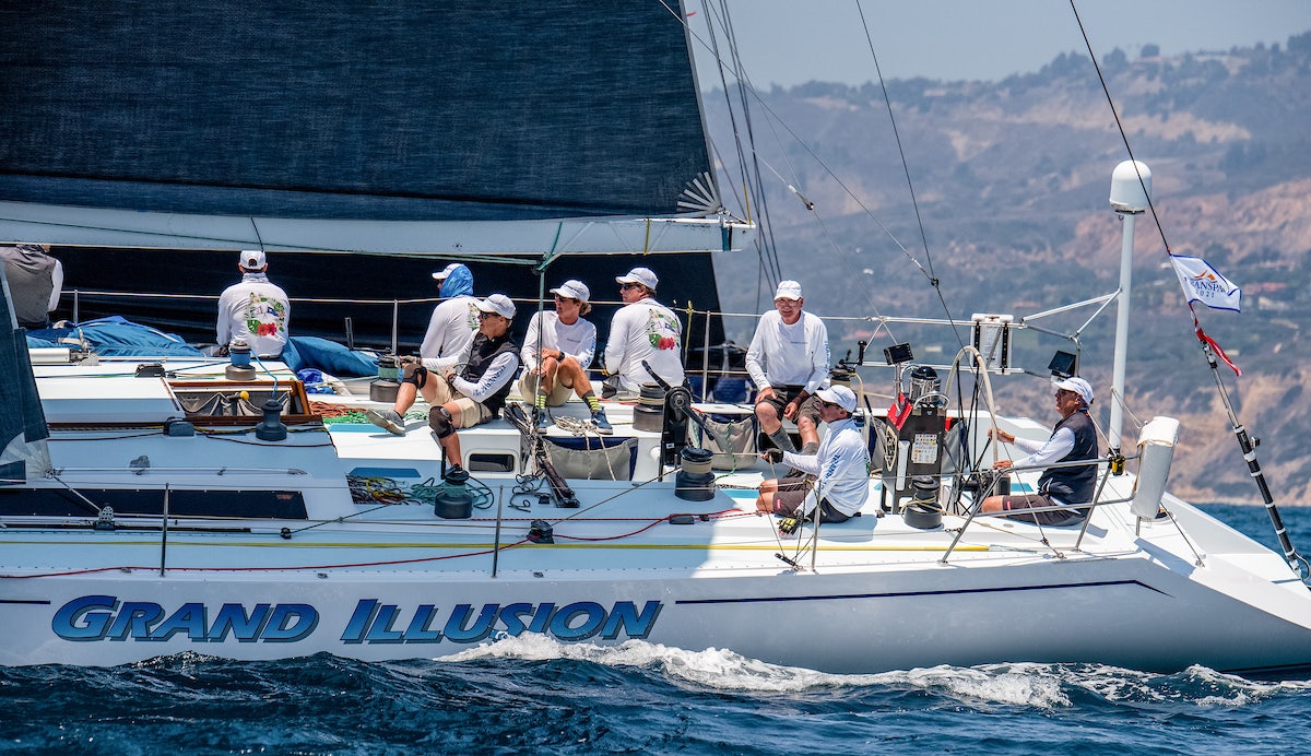 a group of people on a boat aboard GRAND ILLUSION Yacht for Sale