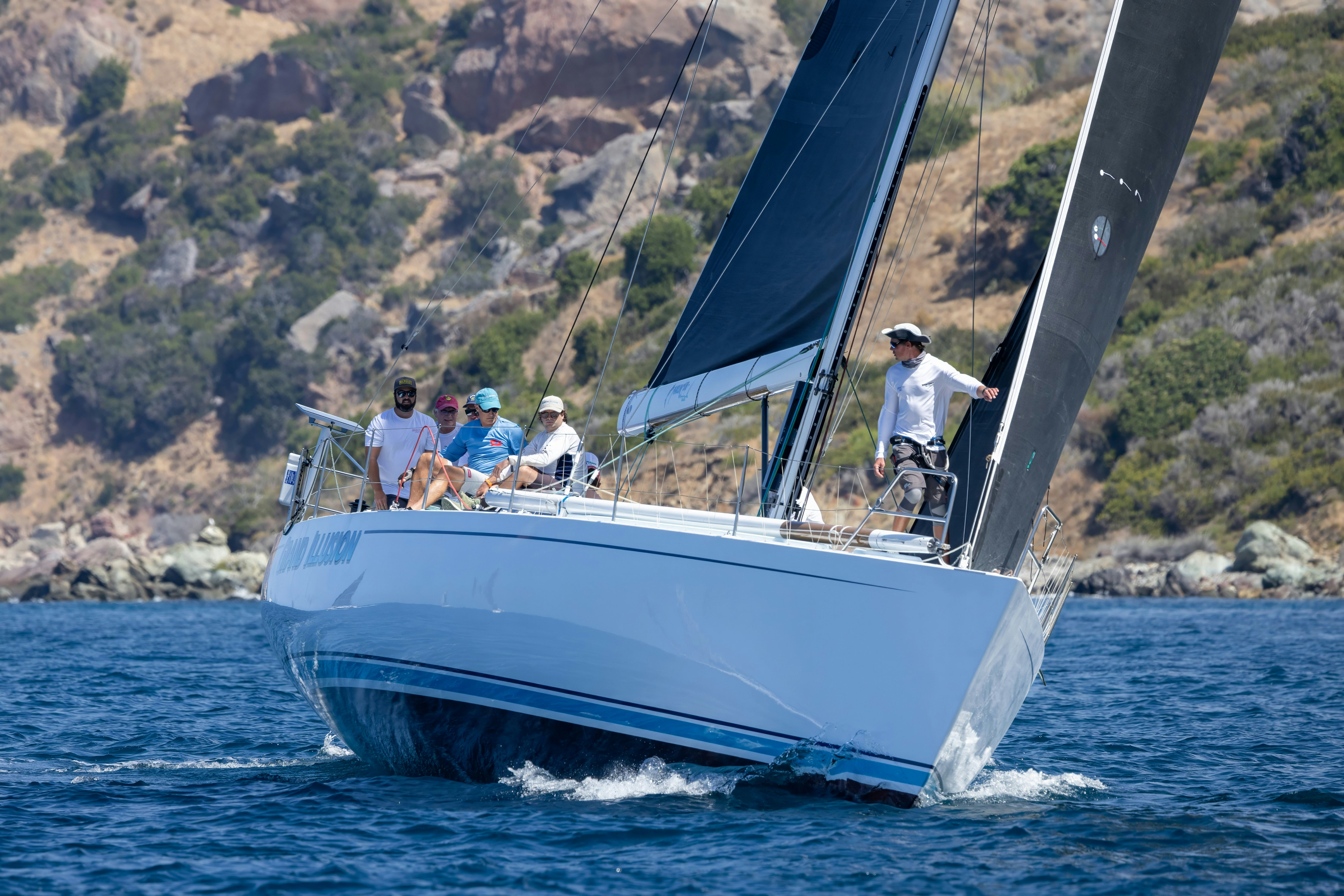 a group of people on a sailboat aboard GRAND ILLUSION Yacht for Sale