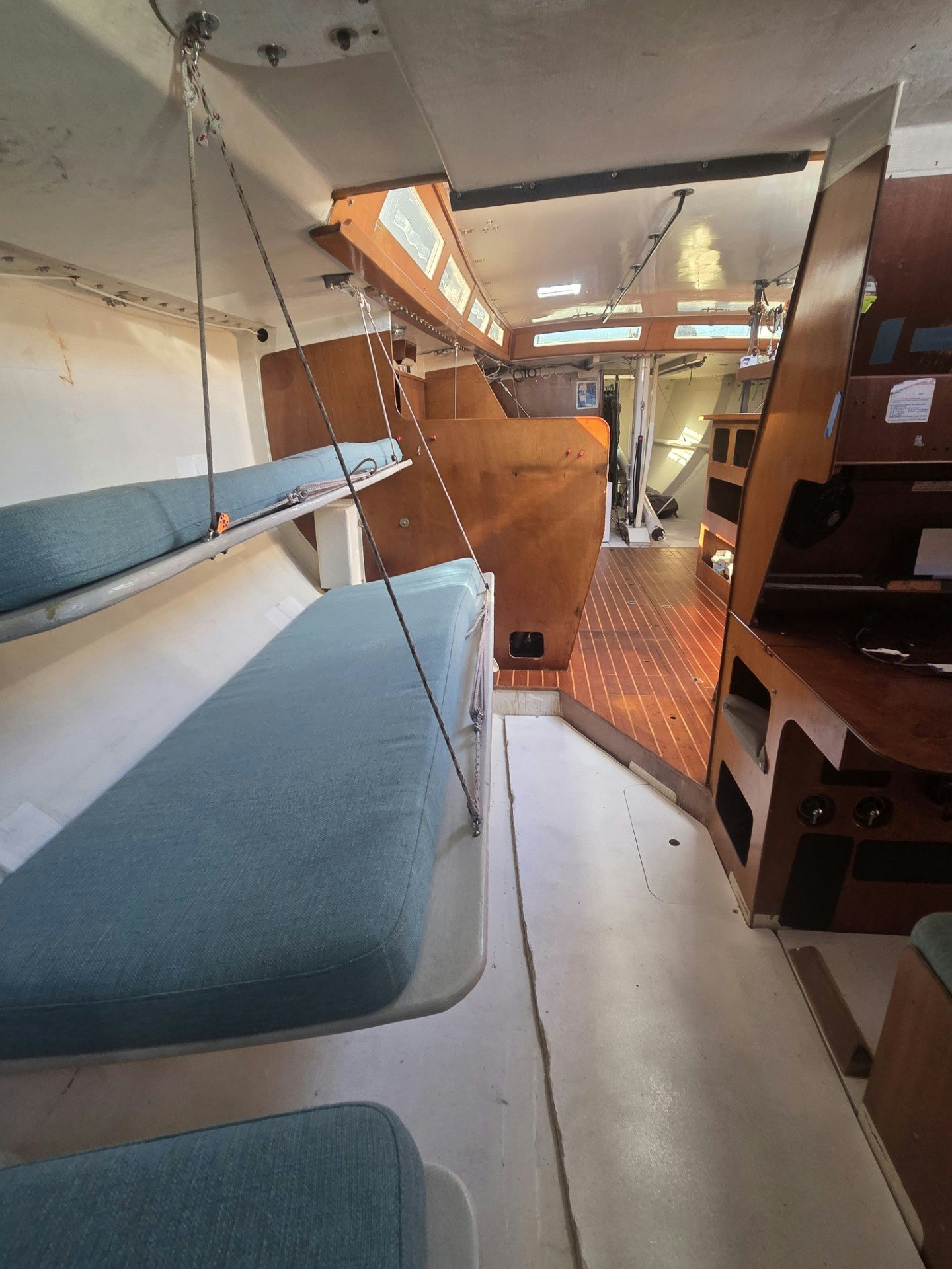 a room with a bed and desk aboard GRAND ILLUSION Yacht for Sale