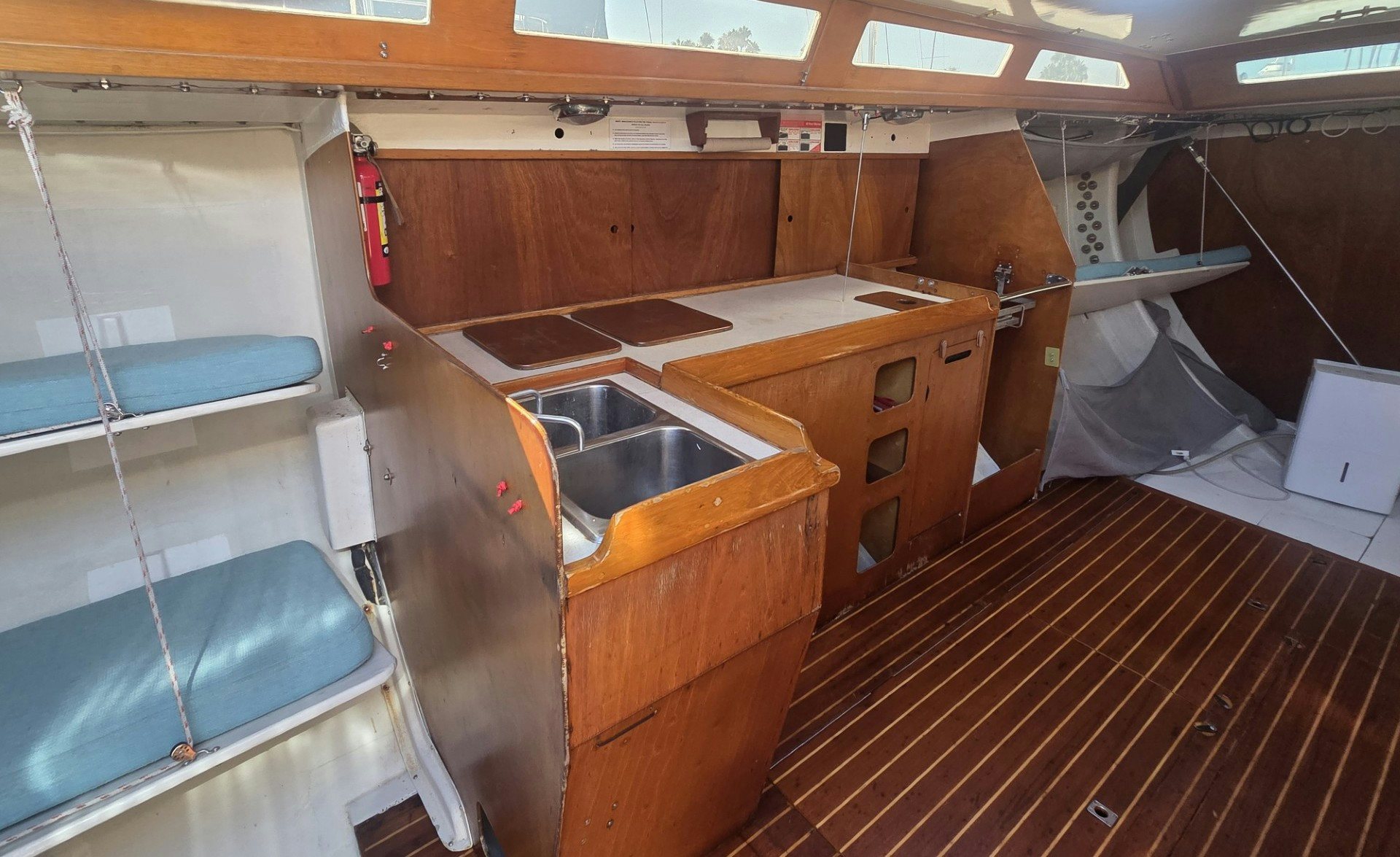 a kitchen with wooden cabinets aboard GRAND ILLUSION Yacht for Sale