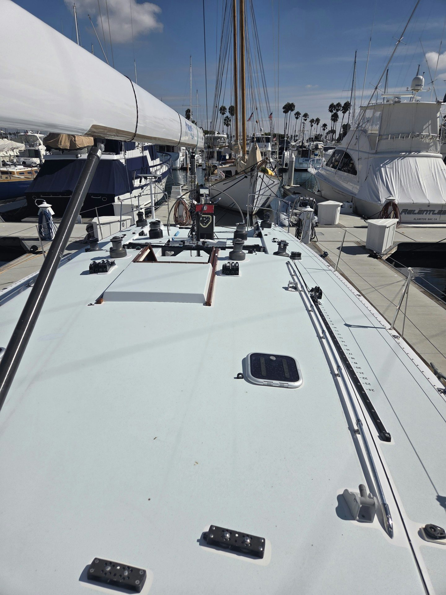 a white boat with a black frame aboard GRAND ILLUSION Yacht for Sale