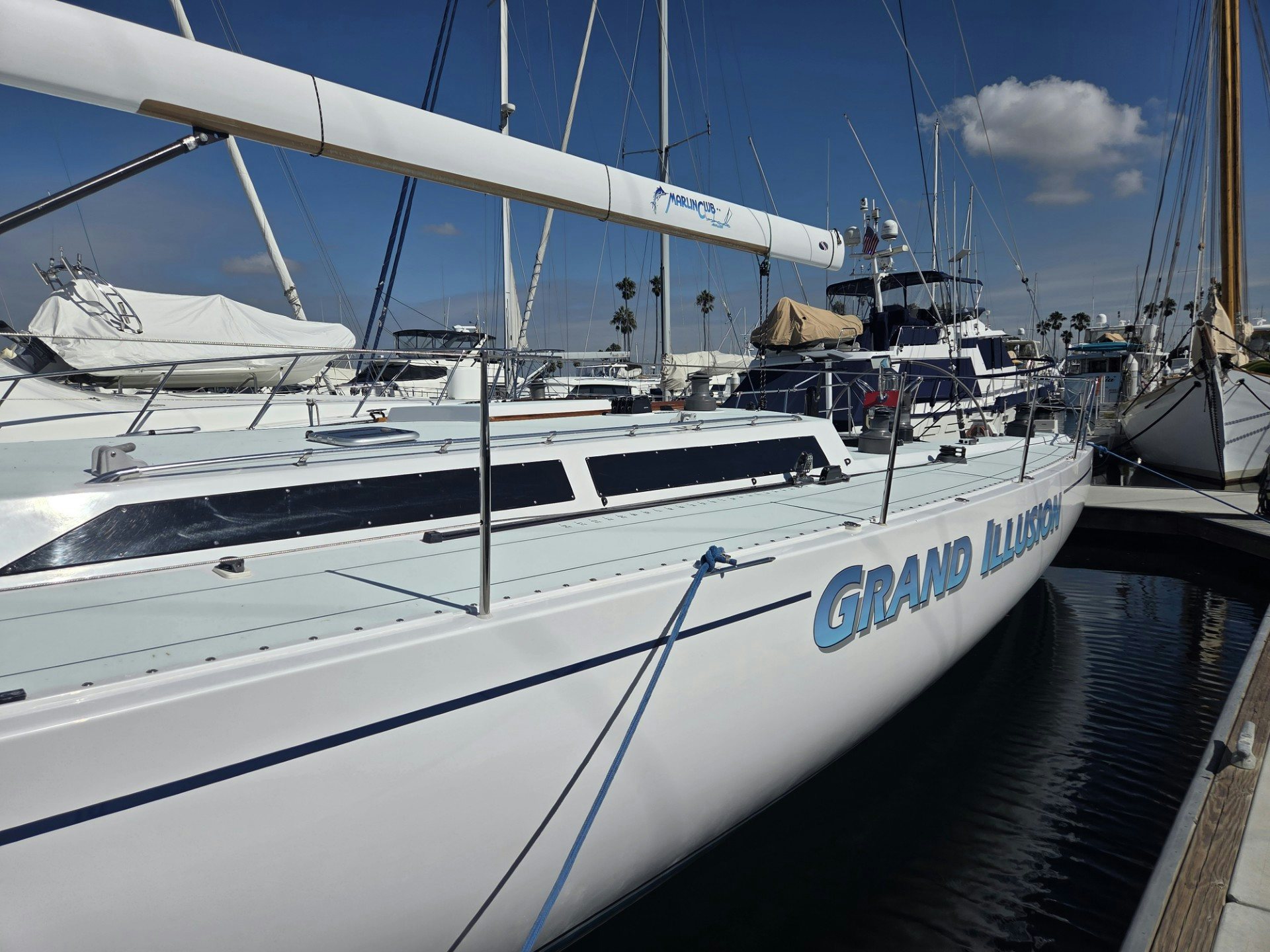 a group of boats are parked in a harbor aboard GRAND ILLUSION Yacht for Sale