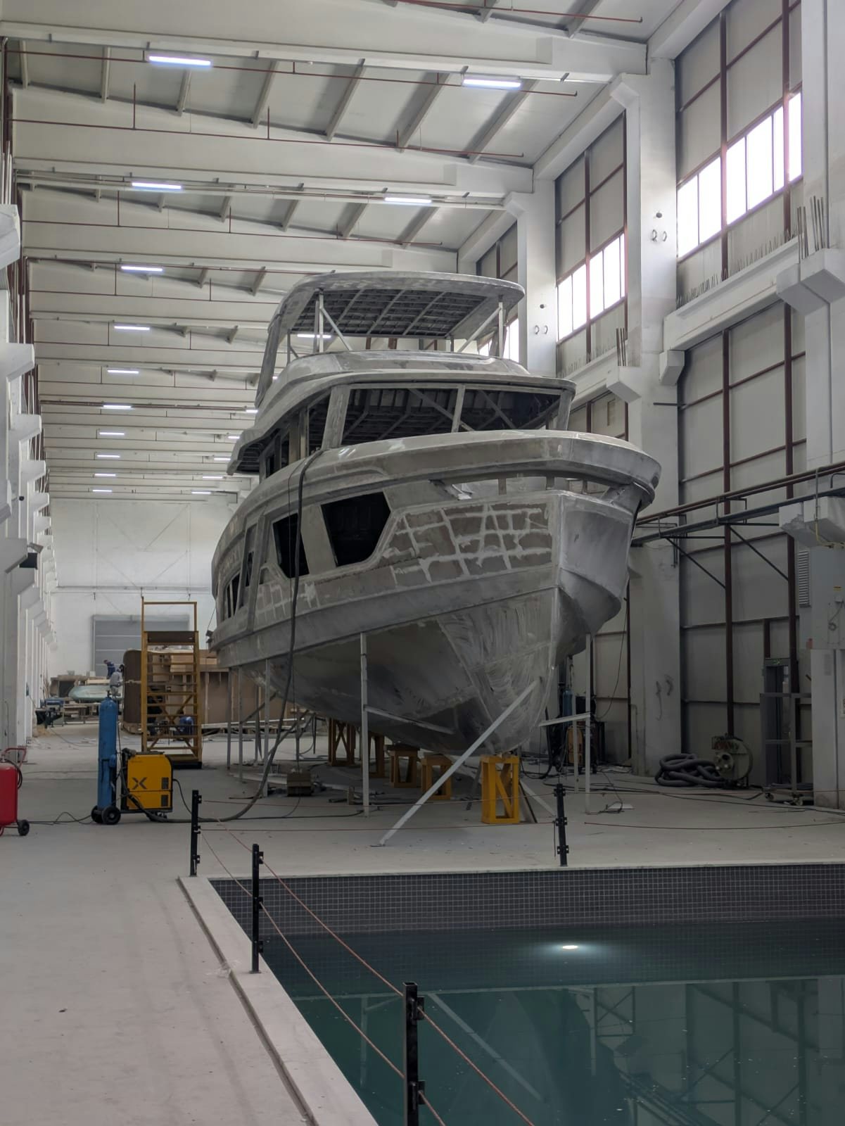 a large machine in a factory aboard SANCREA 70 Yacht for Sale