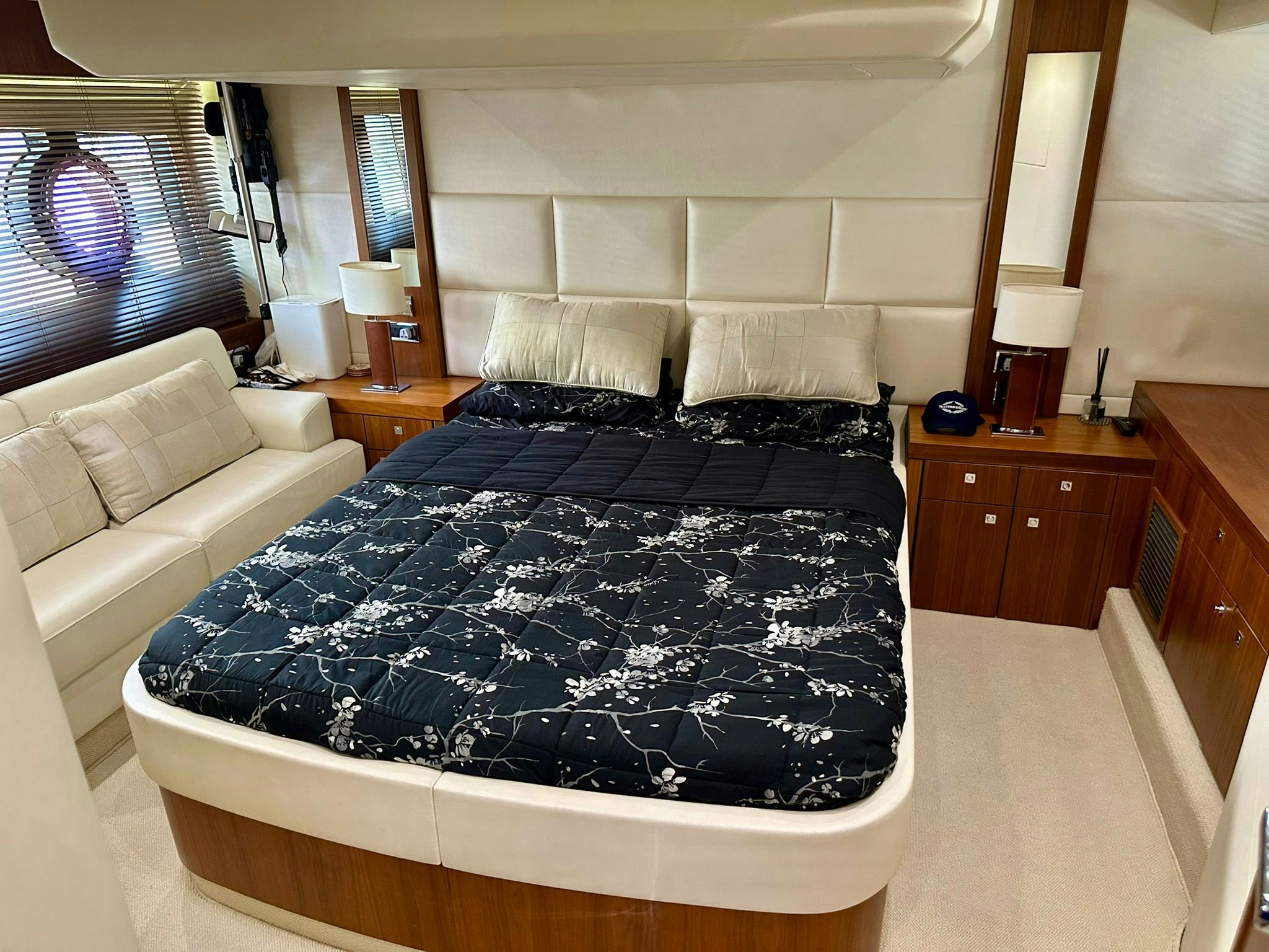 a bedroom with a bed and a couch aboard QUICKSILVER I Yacht for Sale