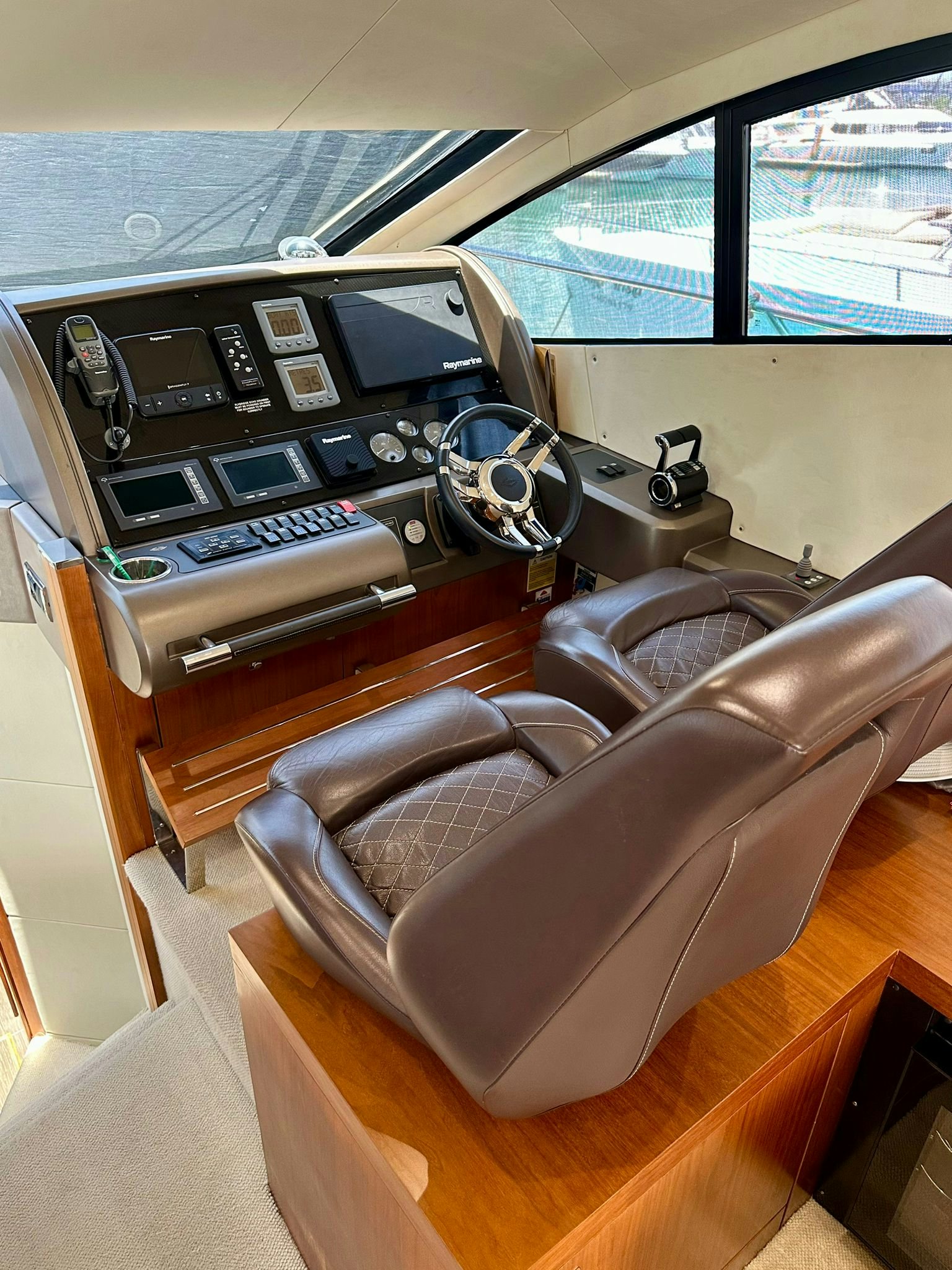 a car with a radio and a chair aboard QUICKSILVER I Yacht for Sale