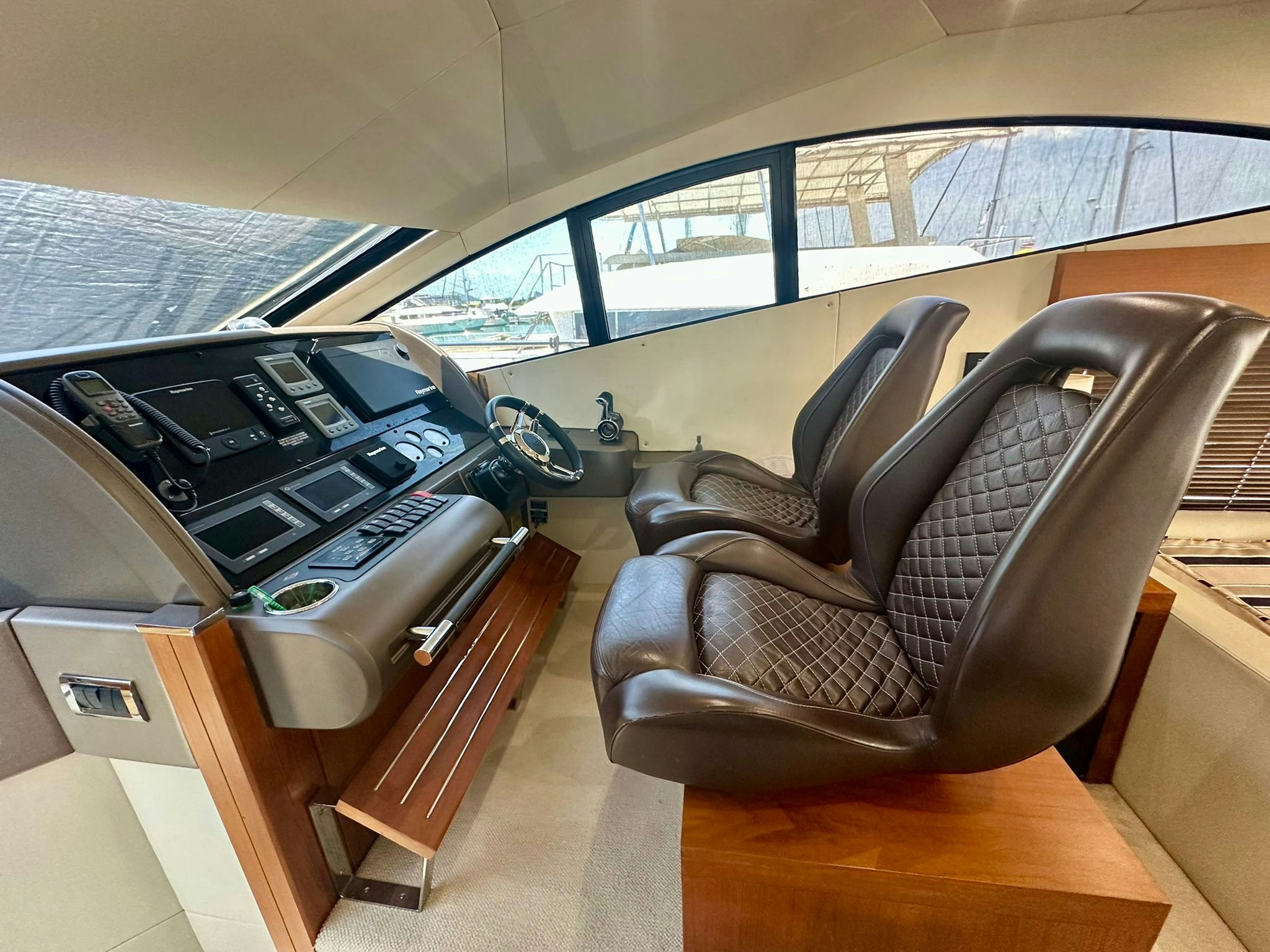 a room with a chair and a piano aboard QUICKSILVER I Yacht for Sale