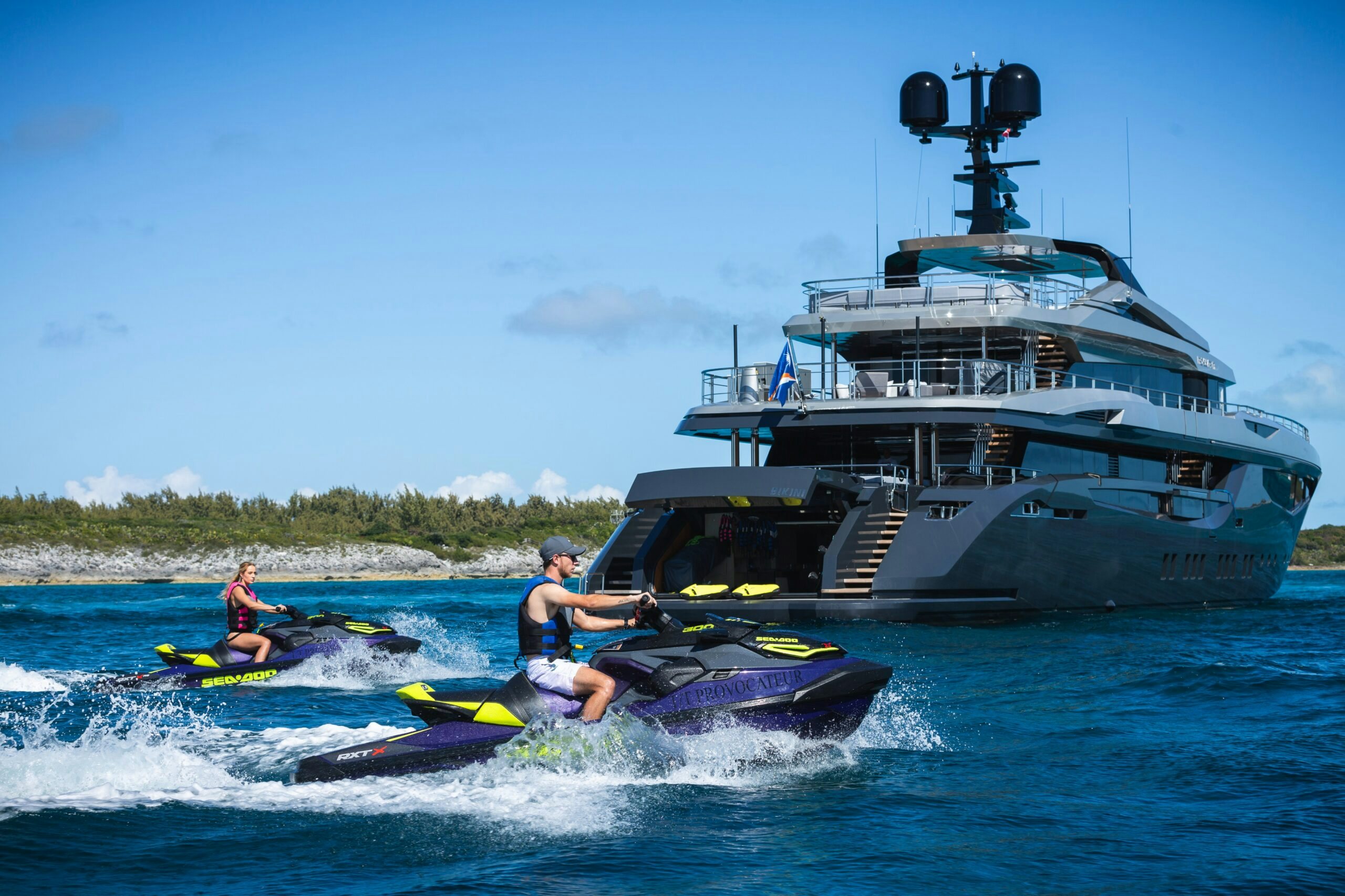 a boat and a couple of people on the water aboard PROVOCATEUR Yacht for Charter