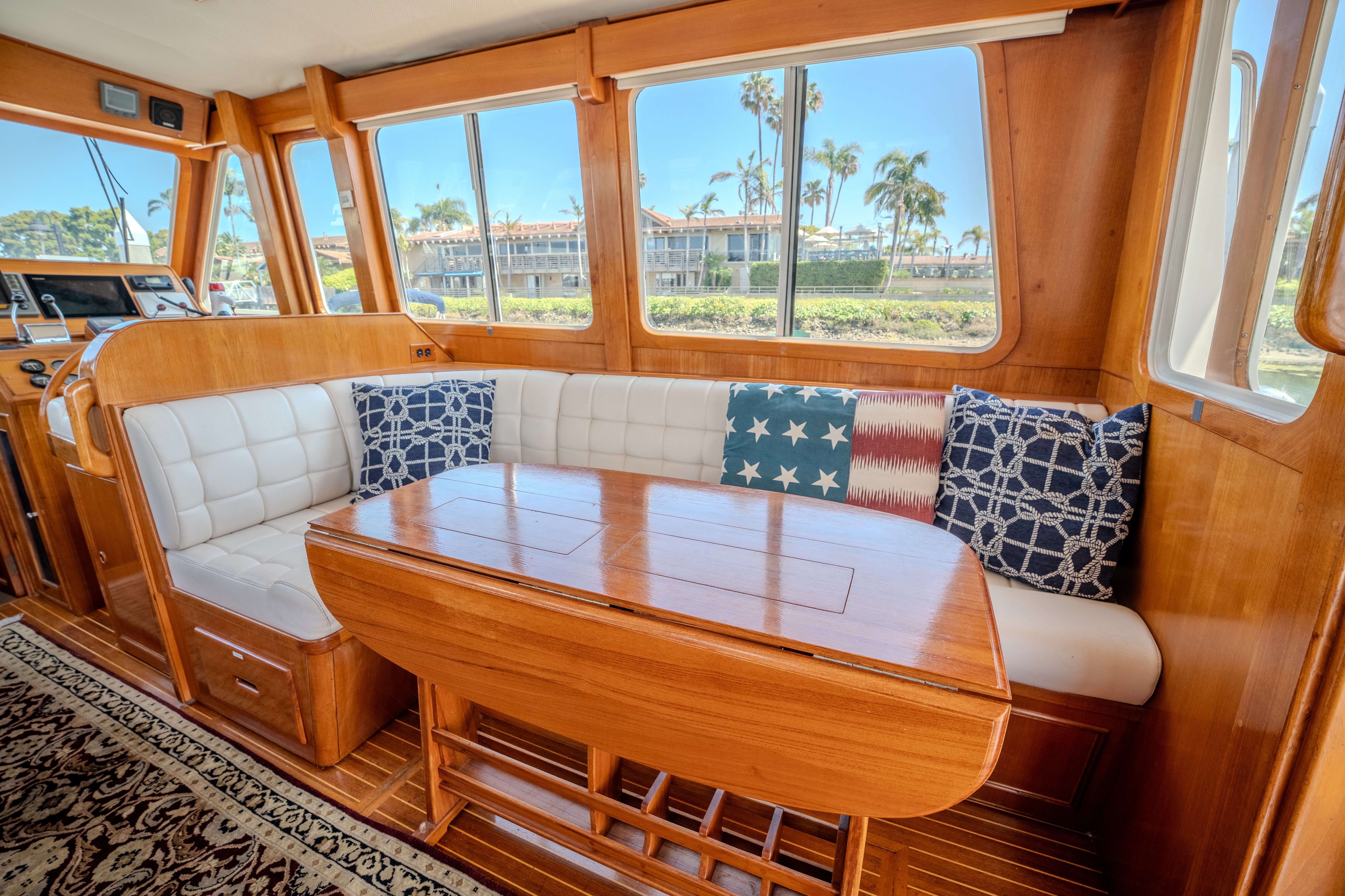 a living room with a table and chairs aboard OSPREY Yacht for Sale