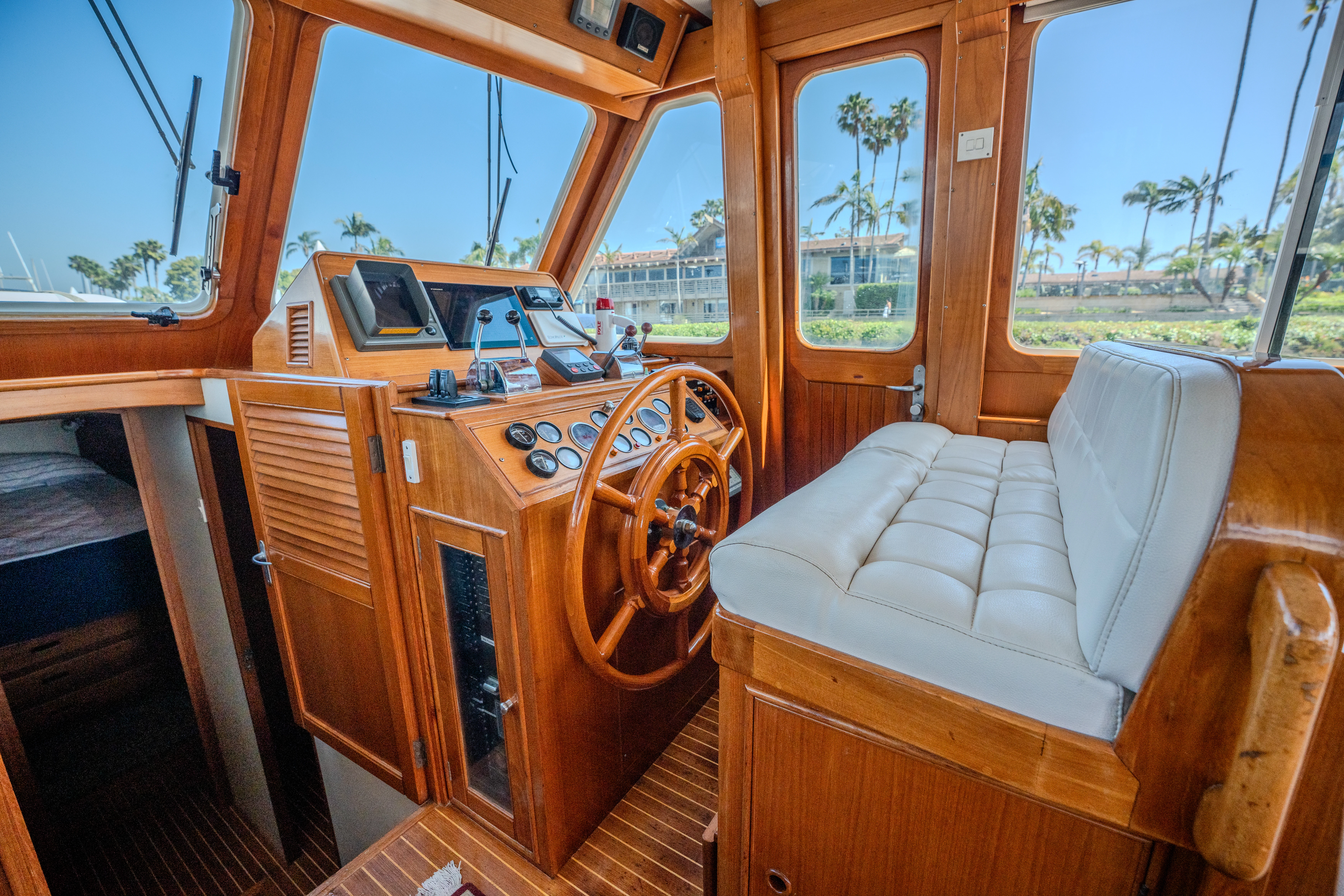 a boat with a couch and a chair in it aboard OSPREY Yacht for Sale
