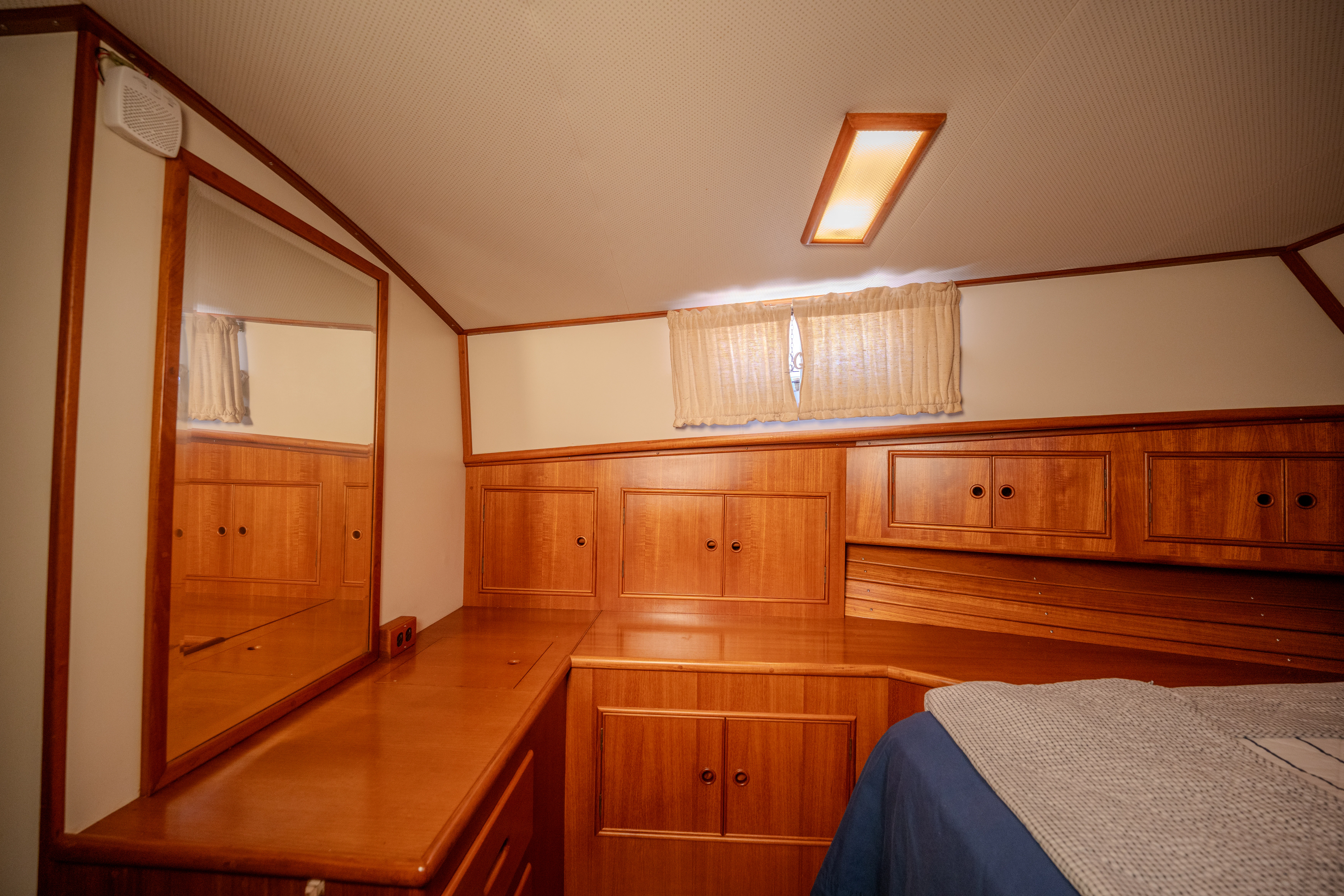a room with wooden cabinets aboard OSPREY Yacht for Sale