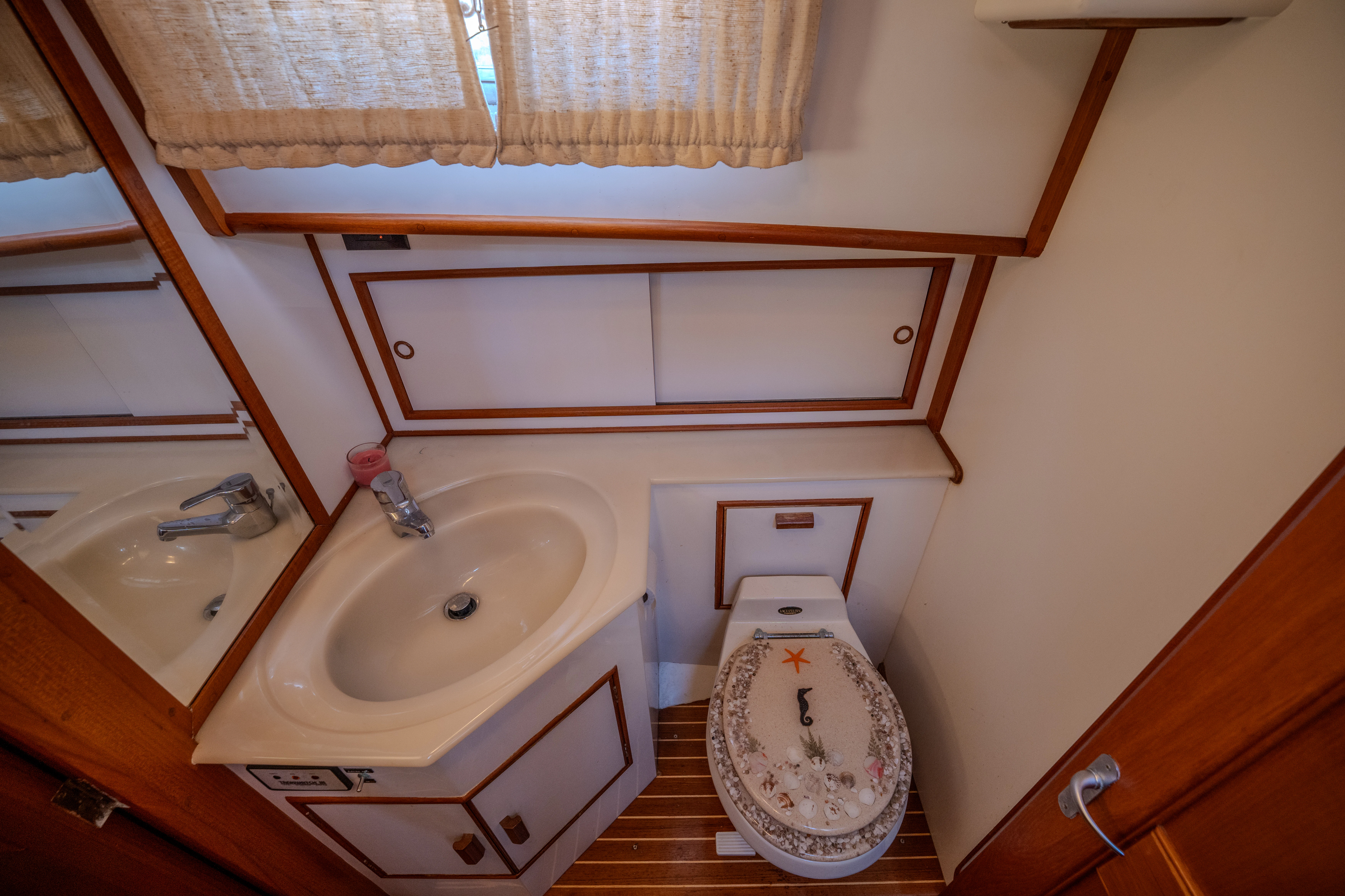 a bathroom with a sink and a toilet aboard OSPREY Yacht for Sale