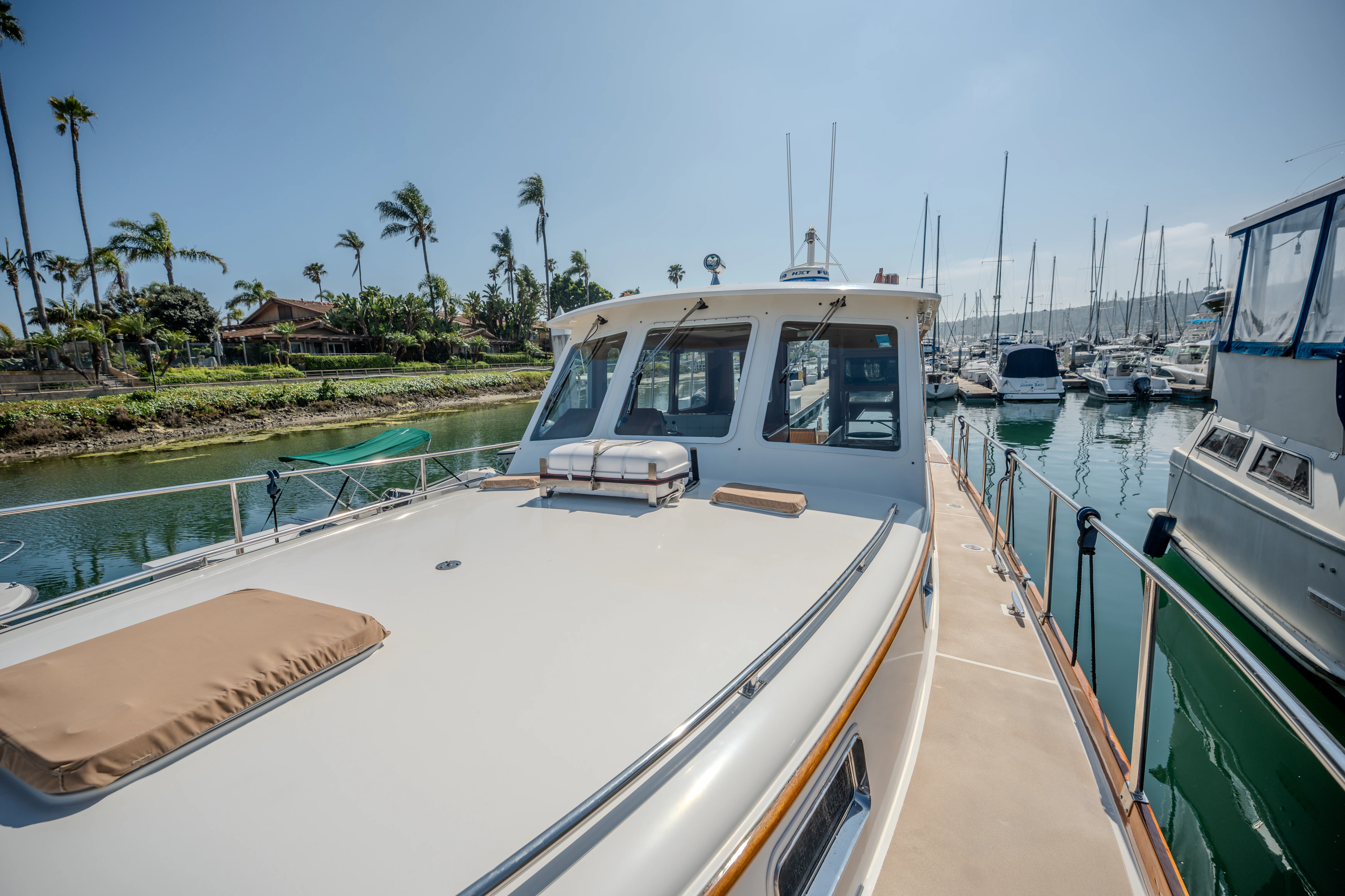 a boat is parked on the side of the water aboard OSPREY Yacht for Sale