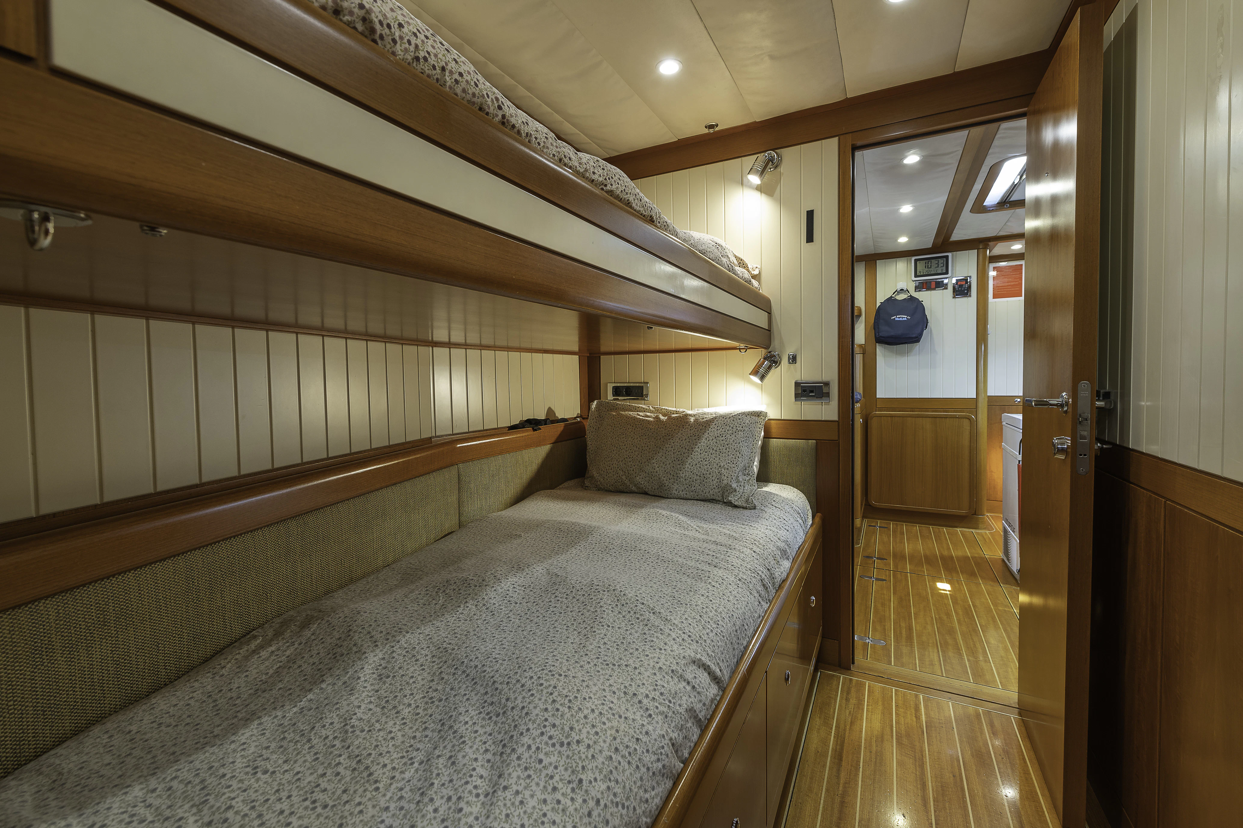 a bed in a room aboard SONG OF THE SEA Yacht for Sale