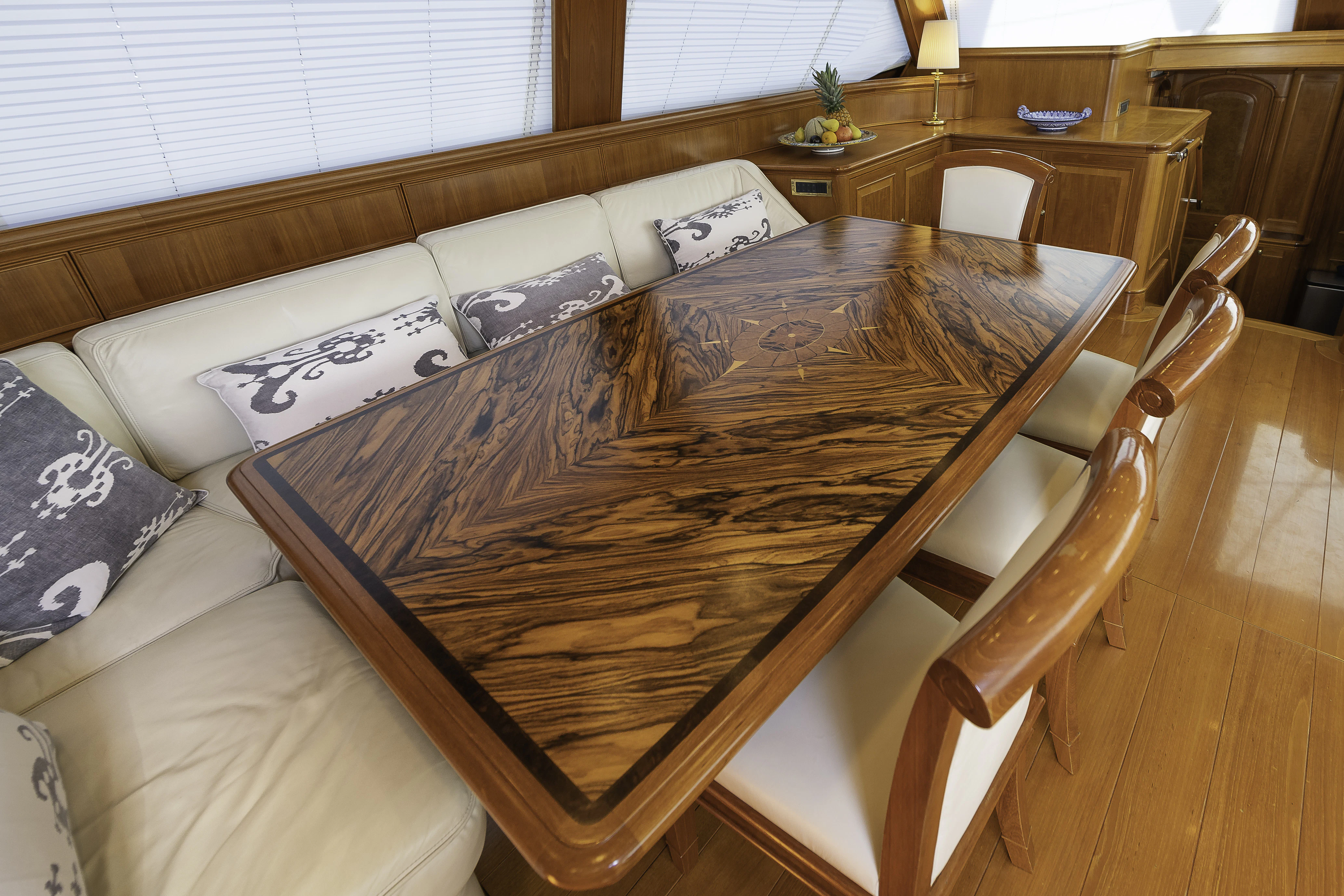 a bed with a wooden frame aboard SONG OF THE SEA Yacht for Sale