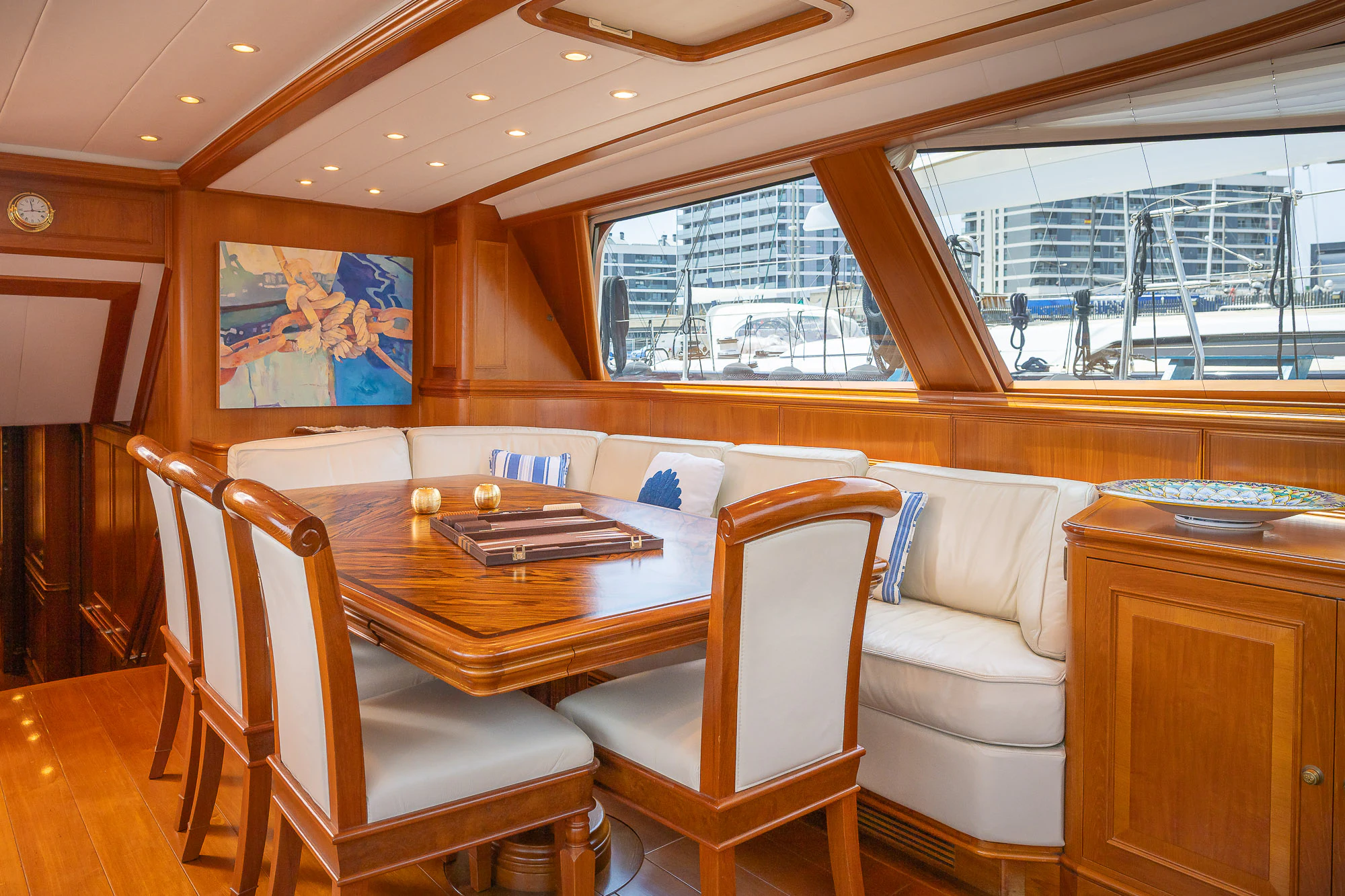 a dining table in a room aboard SONG OF THE SEA Yacht for Sale