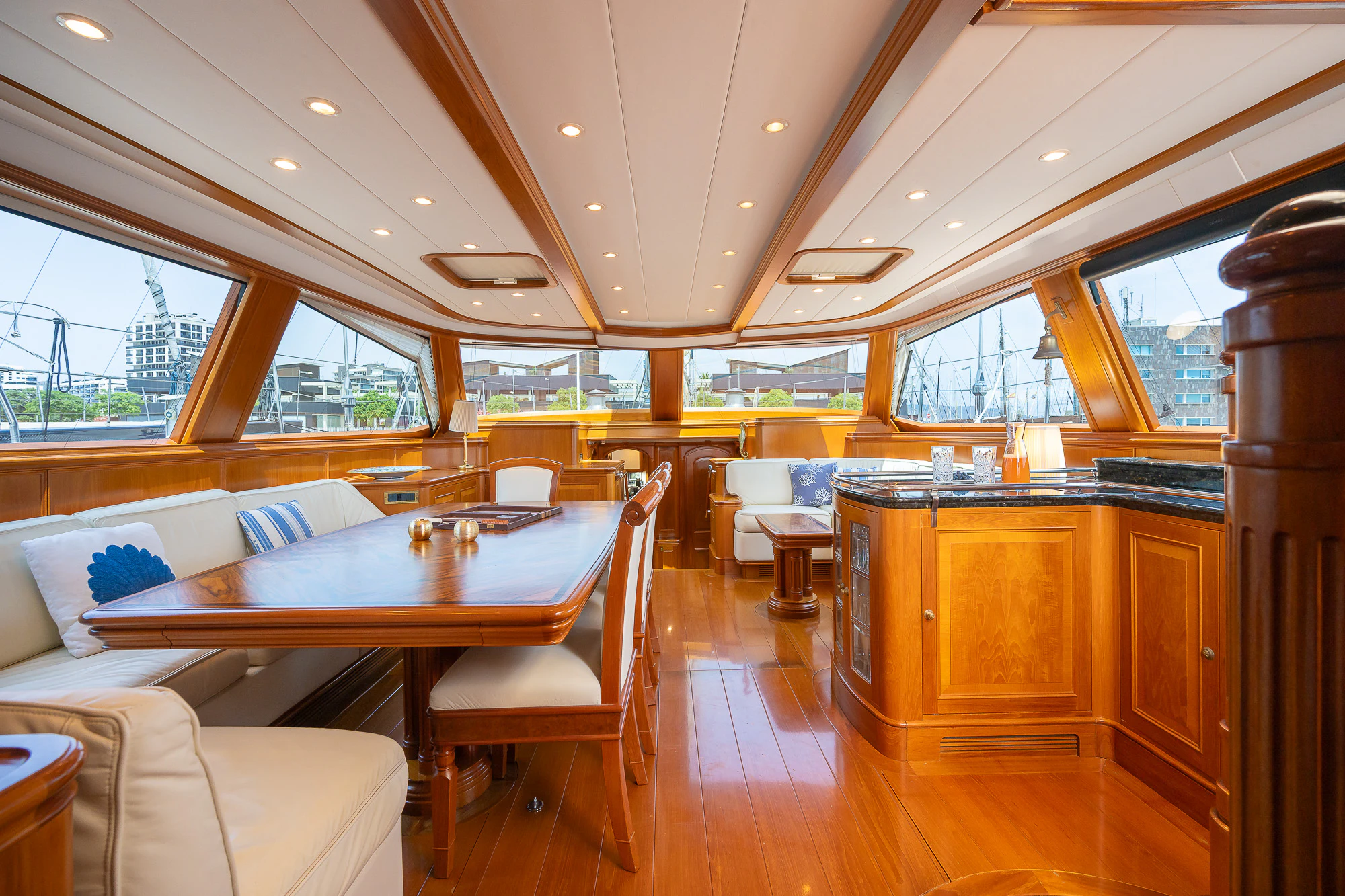 a large kitchen with a table and chairs aboard SONG OF THE SEA Yacht for Sale