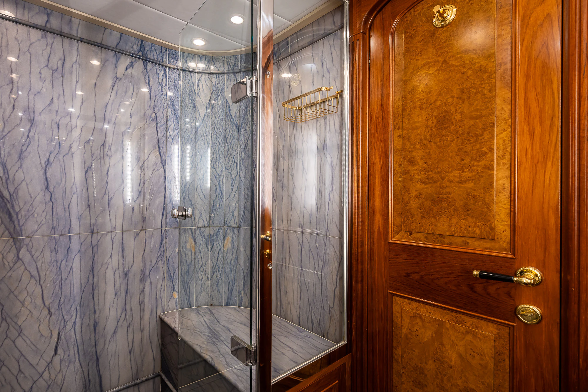 a bathroom with a shower and sink aboard SONG OF THE SEA Yacht for Sale