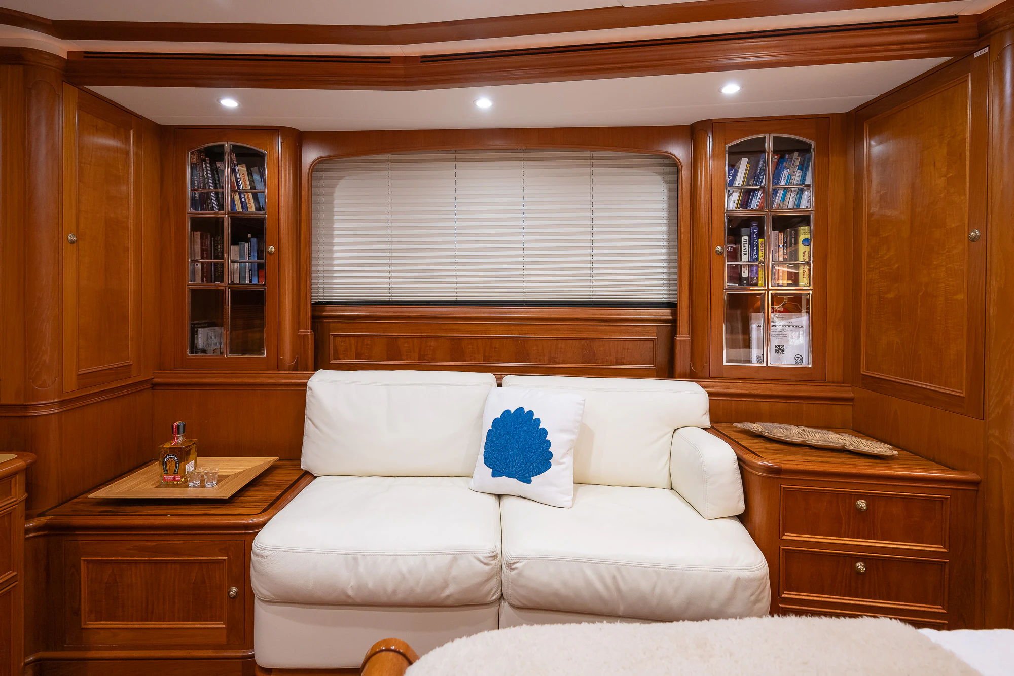 a living room with a white couch aboard SONG OF THE SEA Yacht for Sale