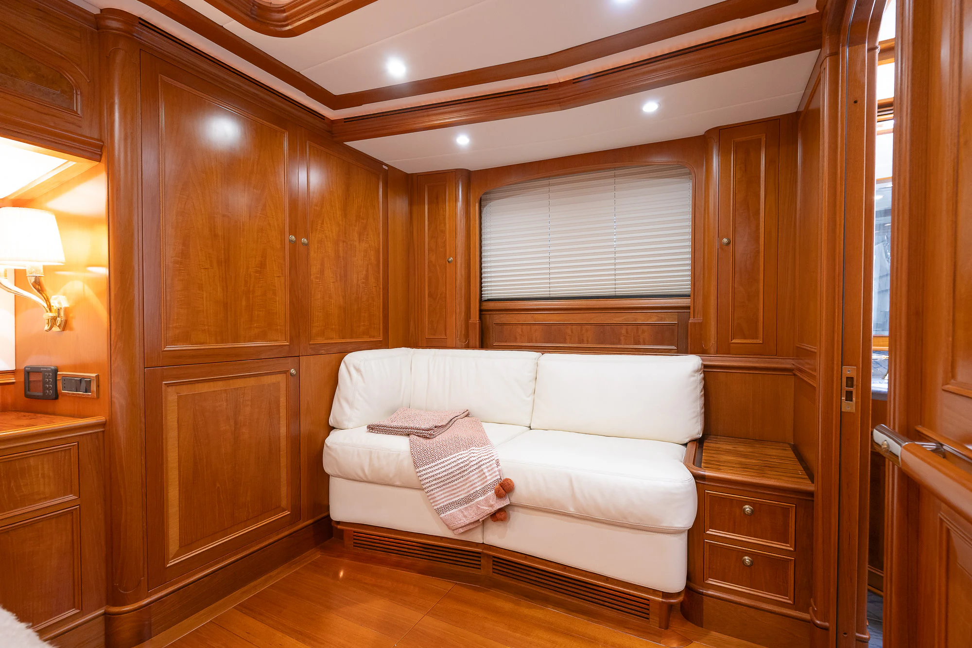 a room with a bed and a wooden wall aboard SONG OF THE SEA Yacht for Sale
