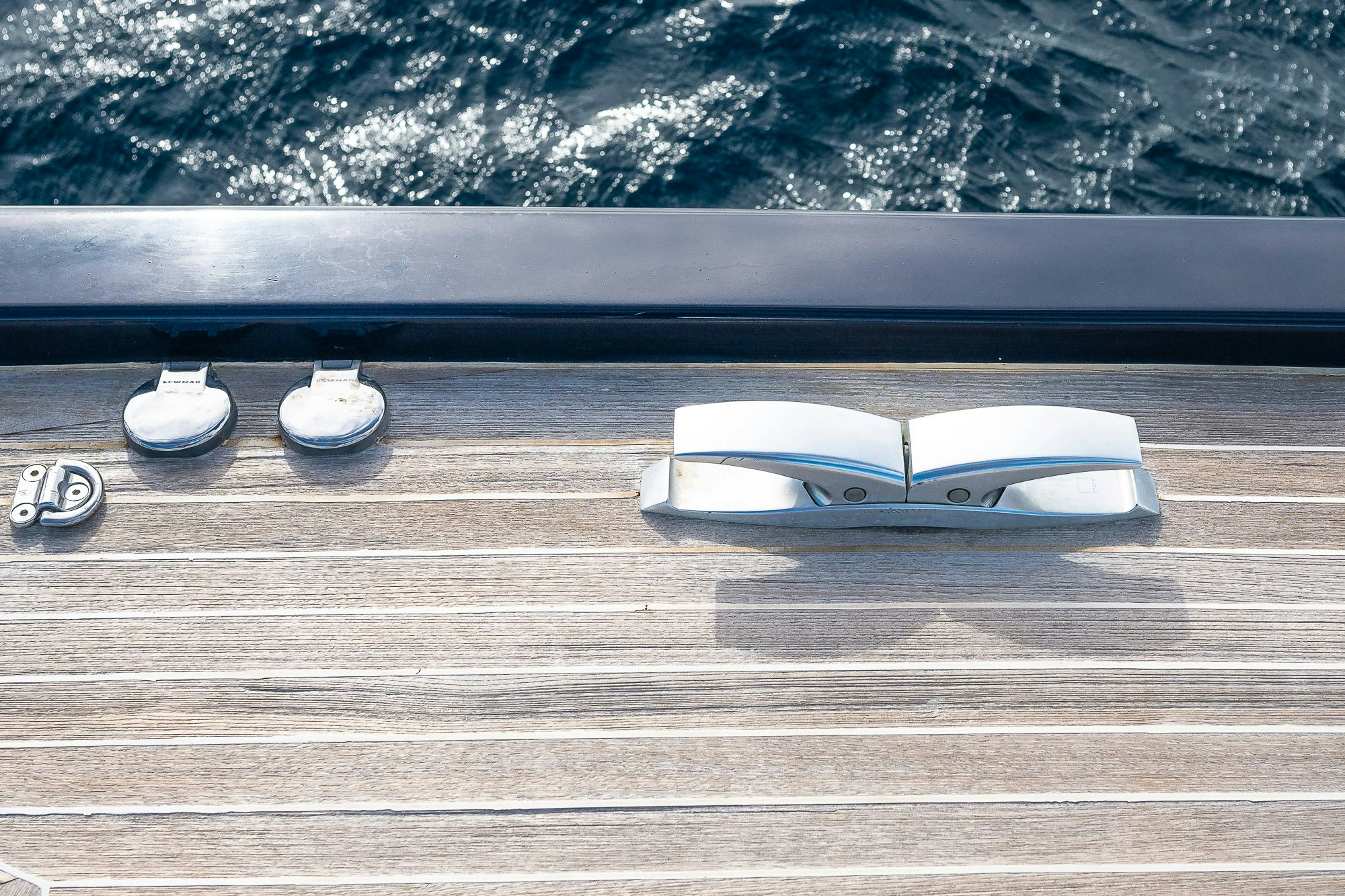 a white computer mouse on a wooden surface aboard KAHUNA Yacht for Sale