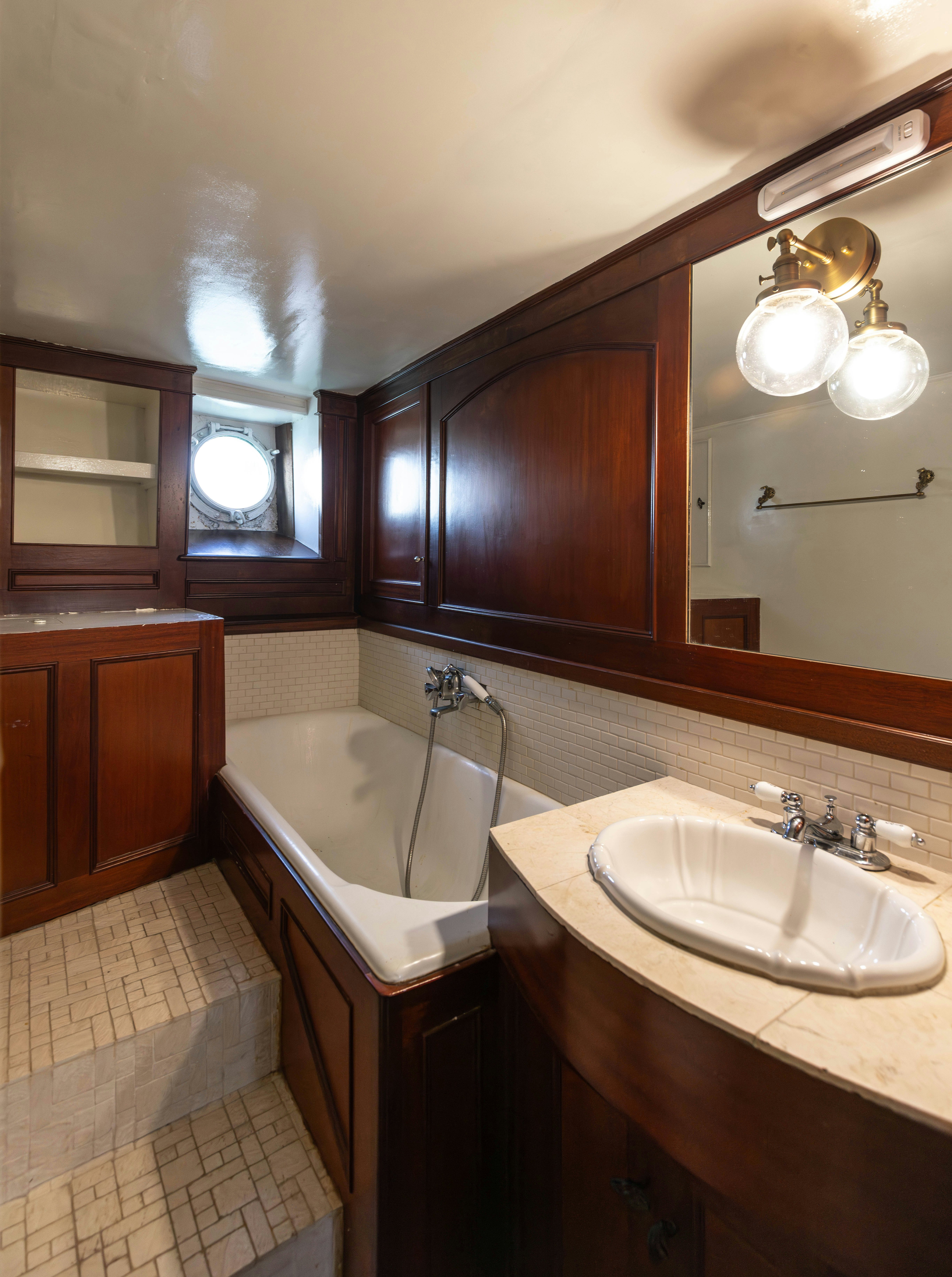 a bathroom with a sink and a bathtub aboard NORTHWIND Yacht for Sale