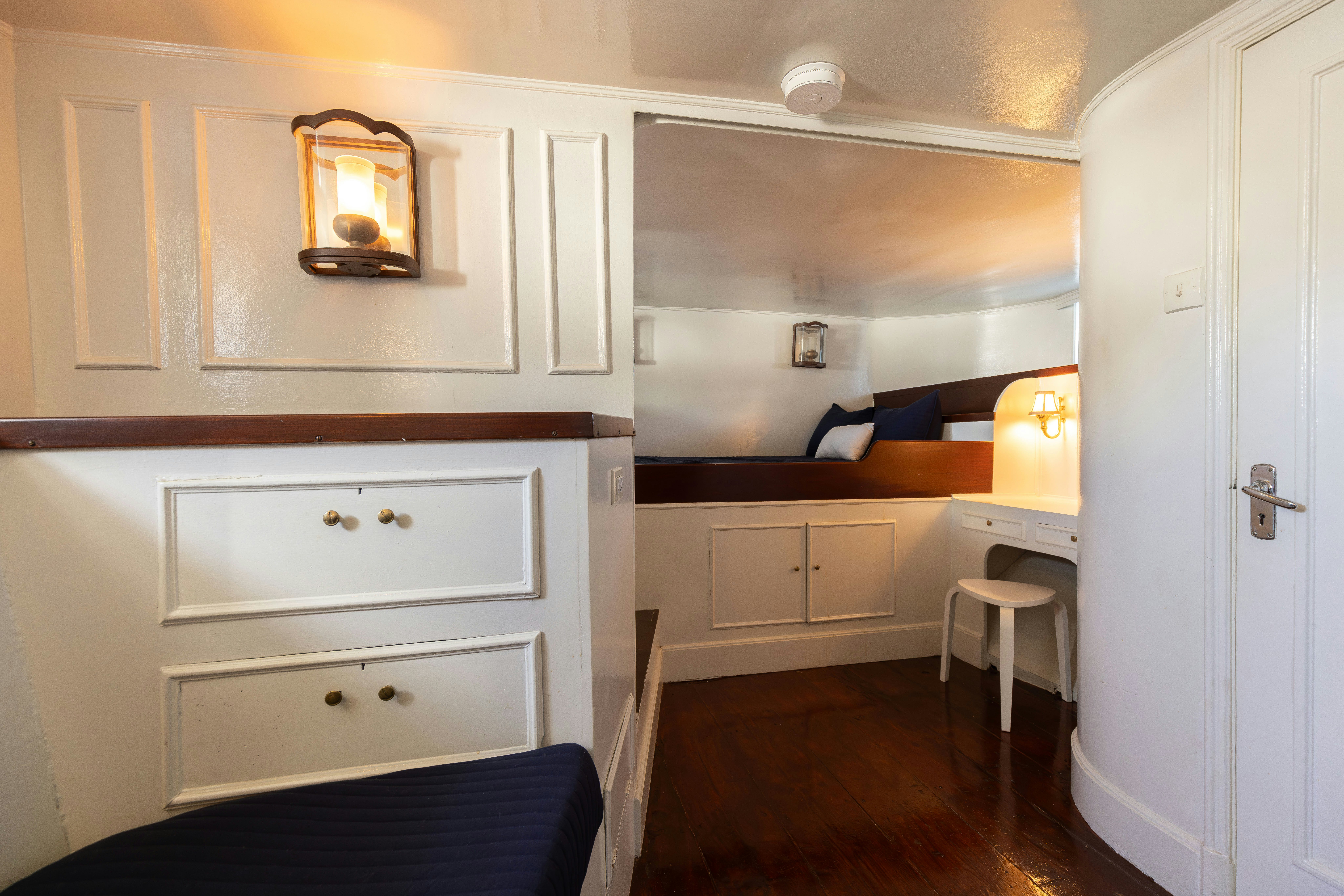 a room with a mirror and cabinets aboard NORTHWIND Yacht for Sale