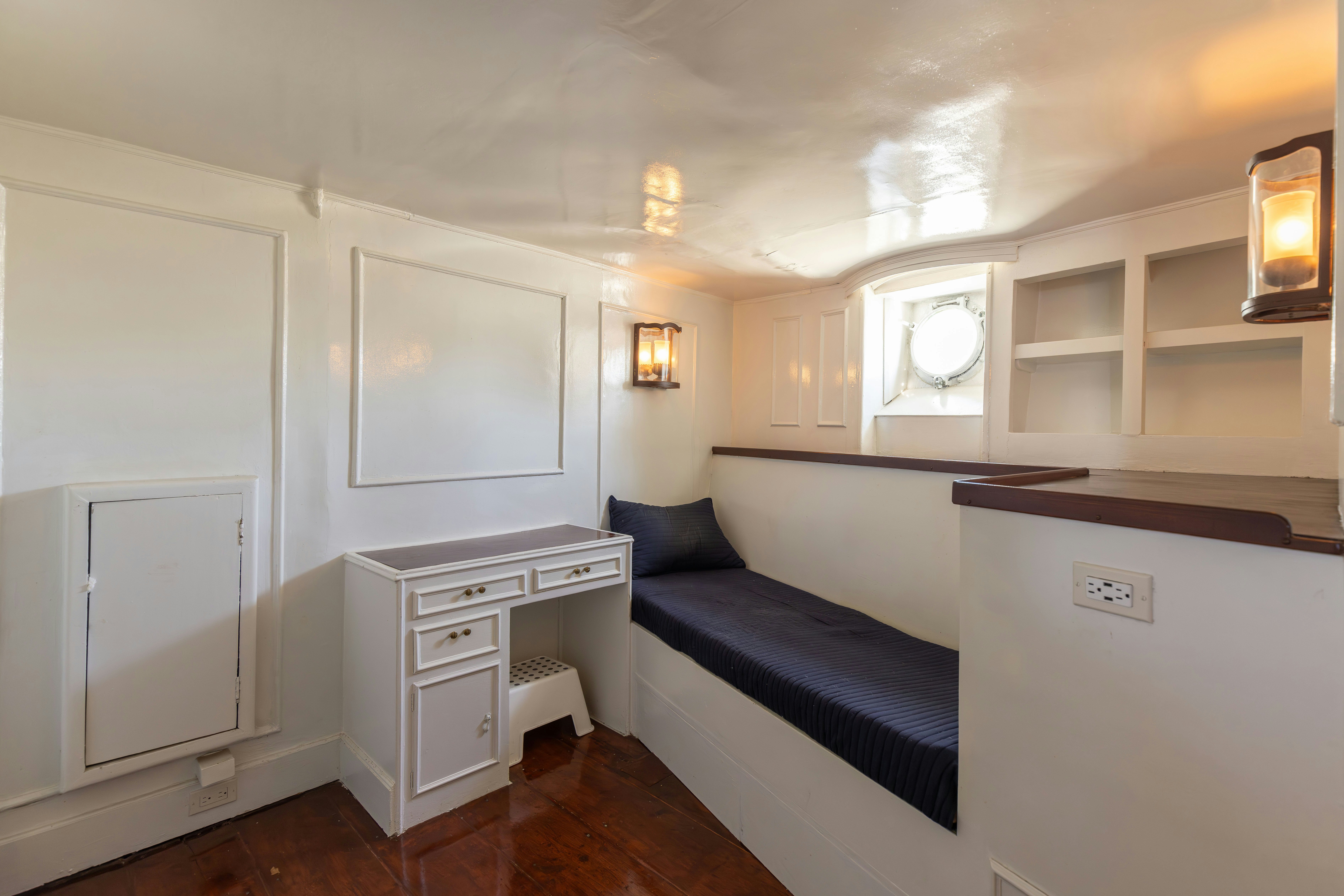 a room with a bed and a desk aboard NORTHWIND Yacht for Sale