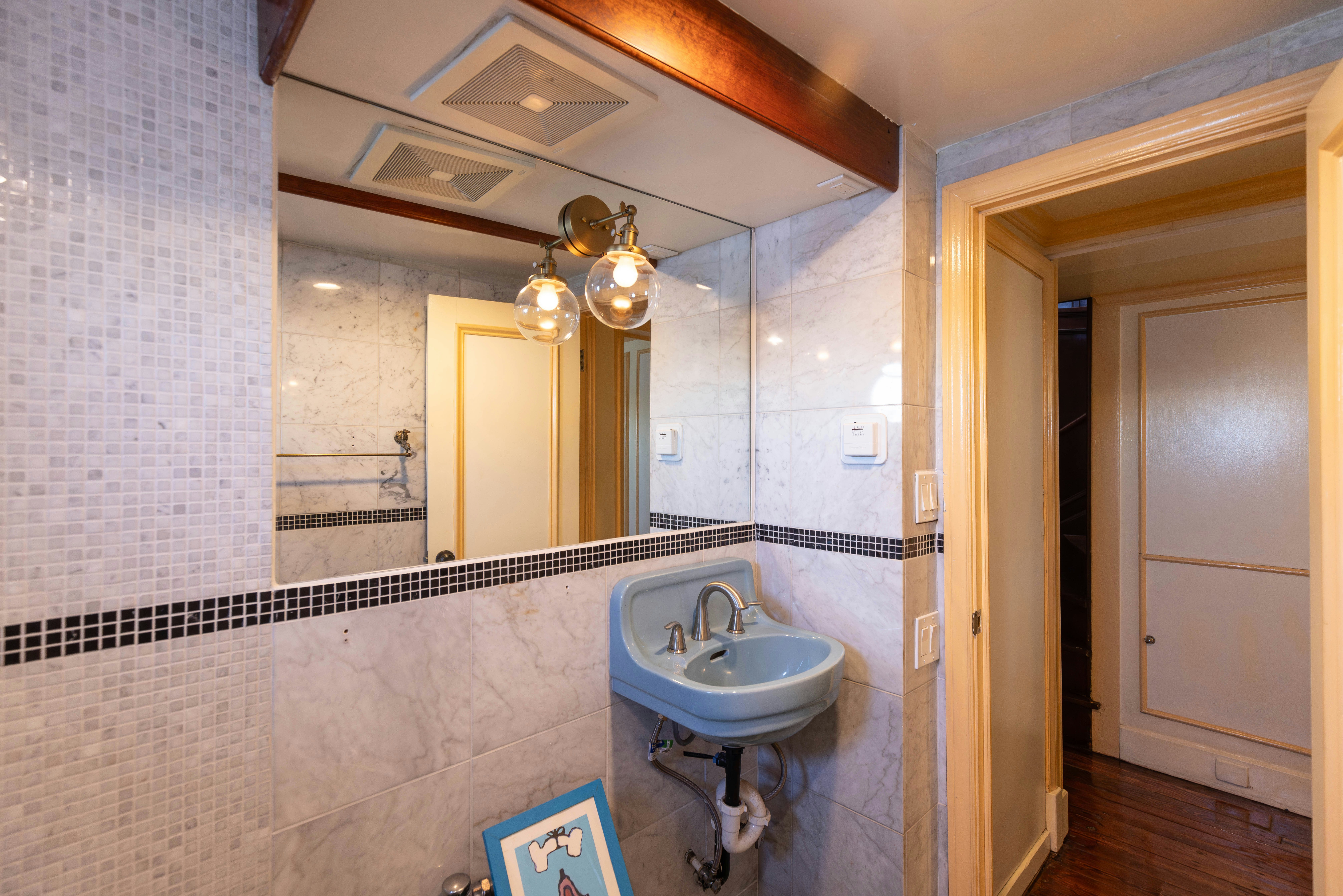 a bathroom with a sink and mirror aboard NORTHWIND Yacht for Sale