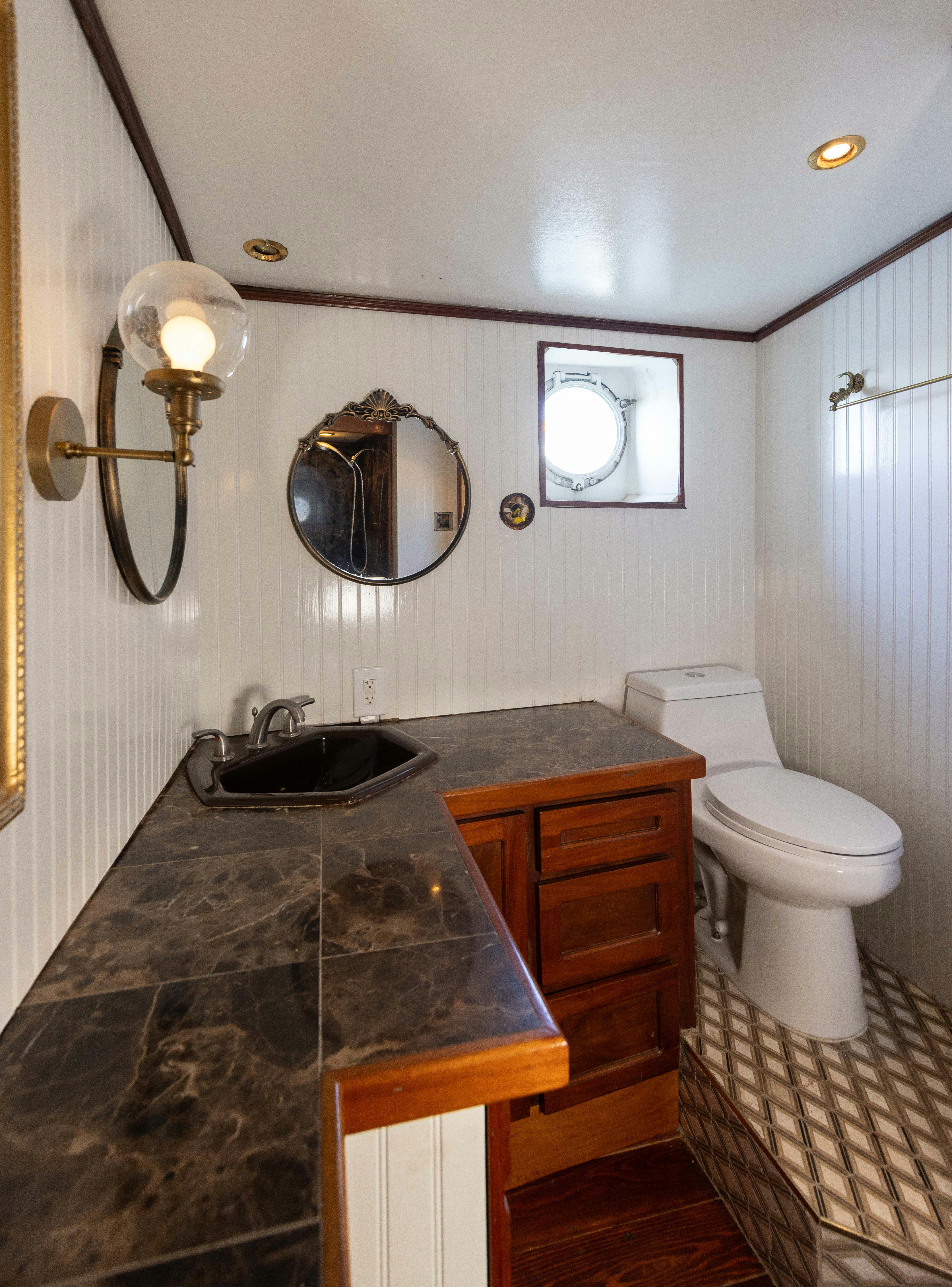 a bathroom with a sink and a toilet aboard NORTHWIND Yacht for Sale