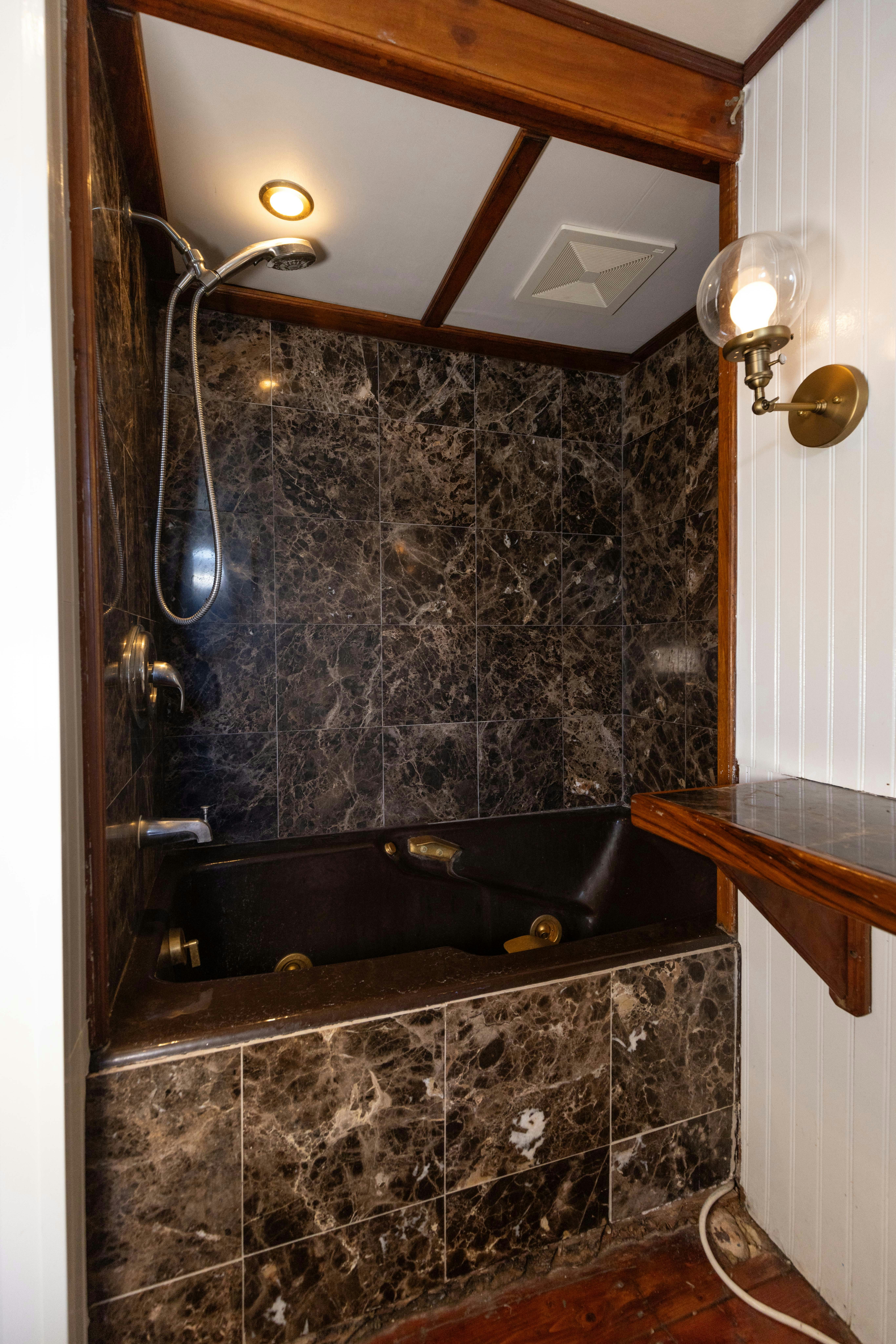 a bathroom with a stone shower aboard NORTHWIND Yacht for Sale