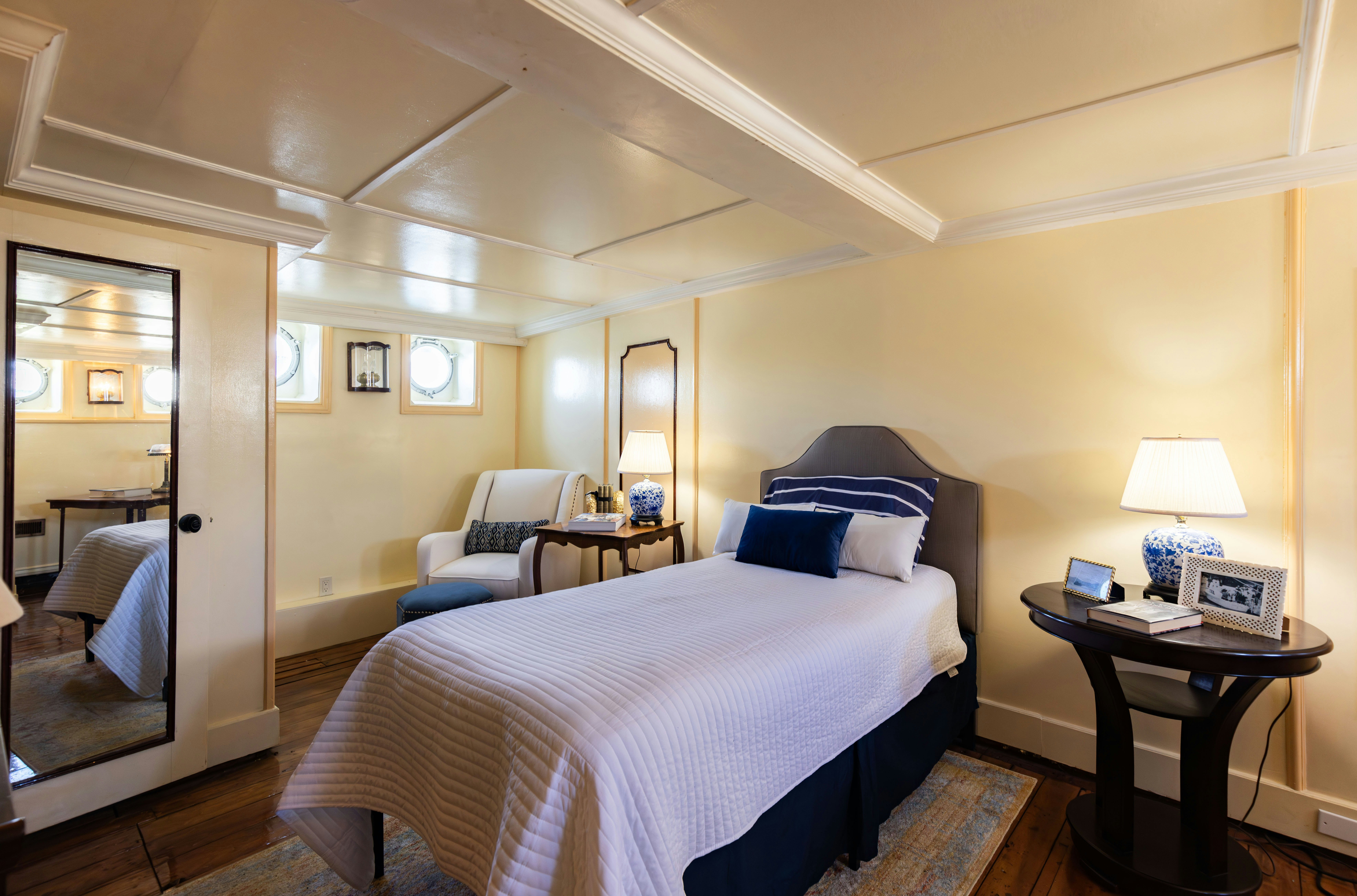 a bedroom with a bed and a desk aboard NORTHWIND Yacht for Sale