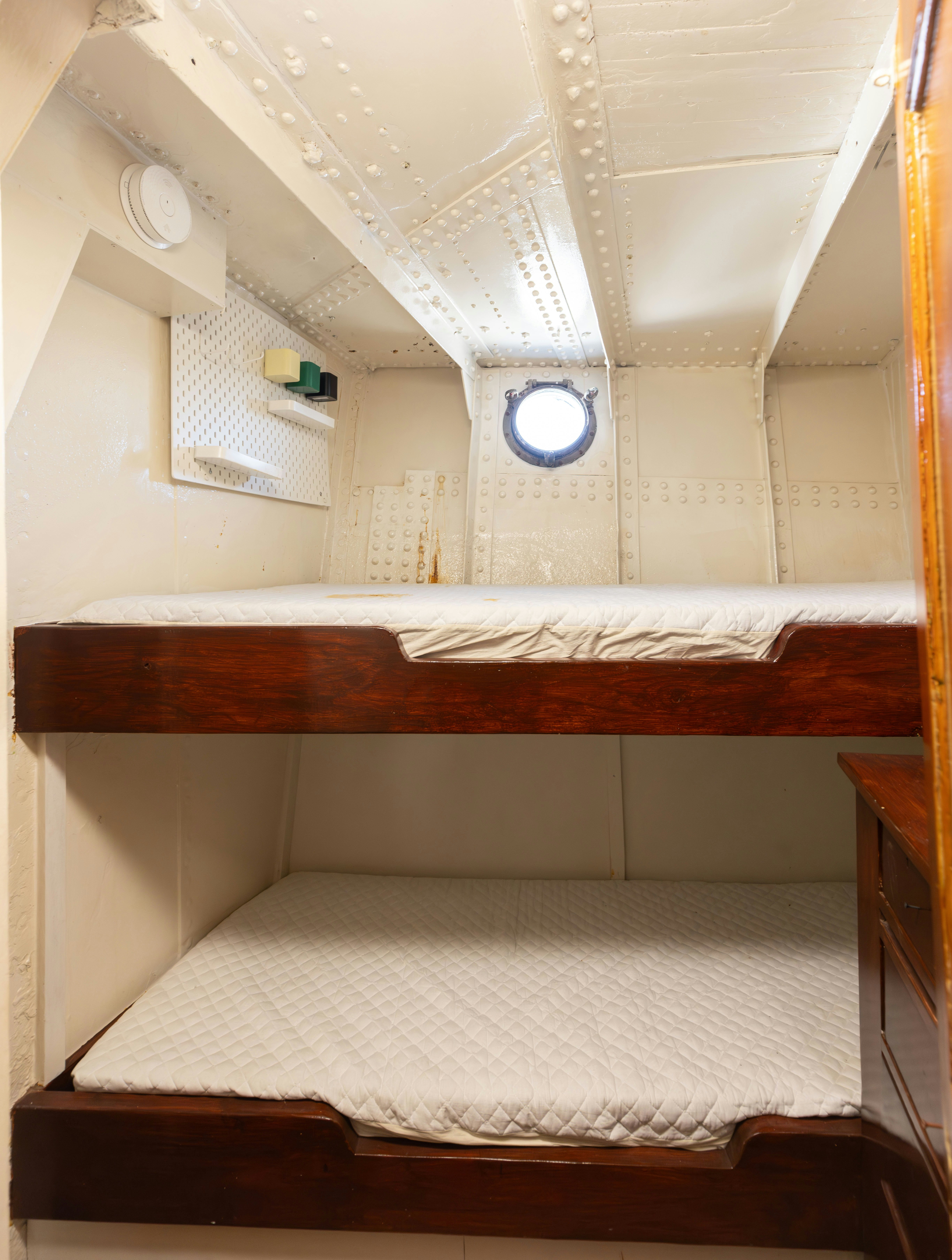 a room with a bed and a window aboard NORTHWIND Yacht for Sale