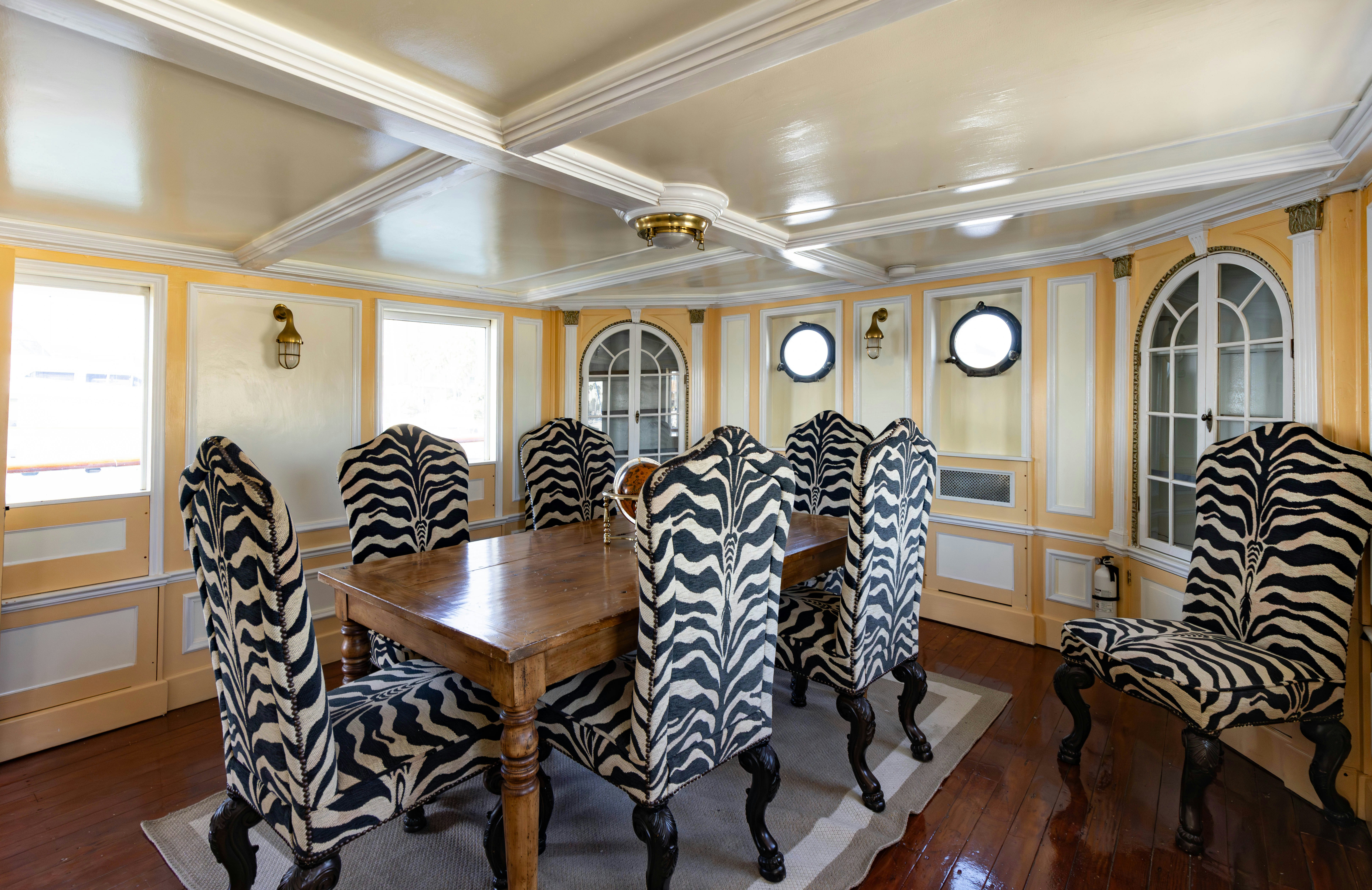 a dining room with chairs aboard NORTHWIND Yacht for Sale