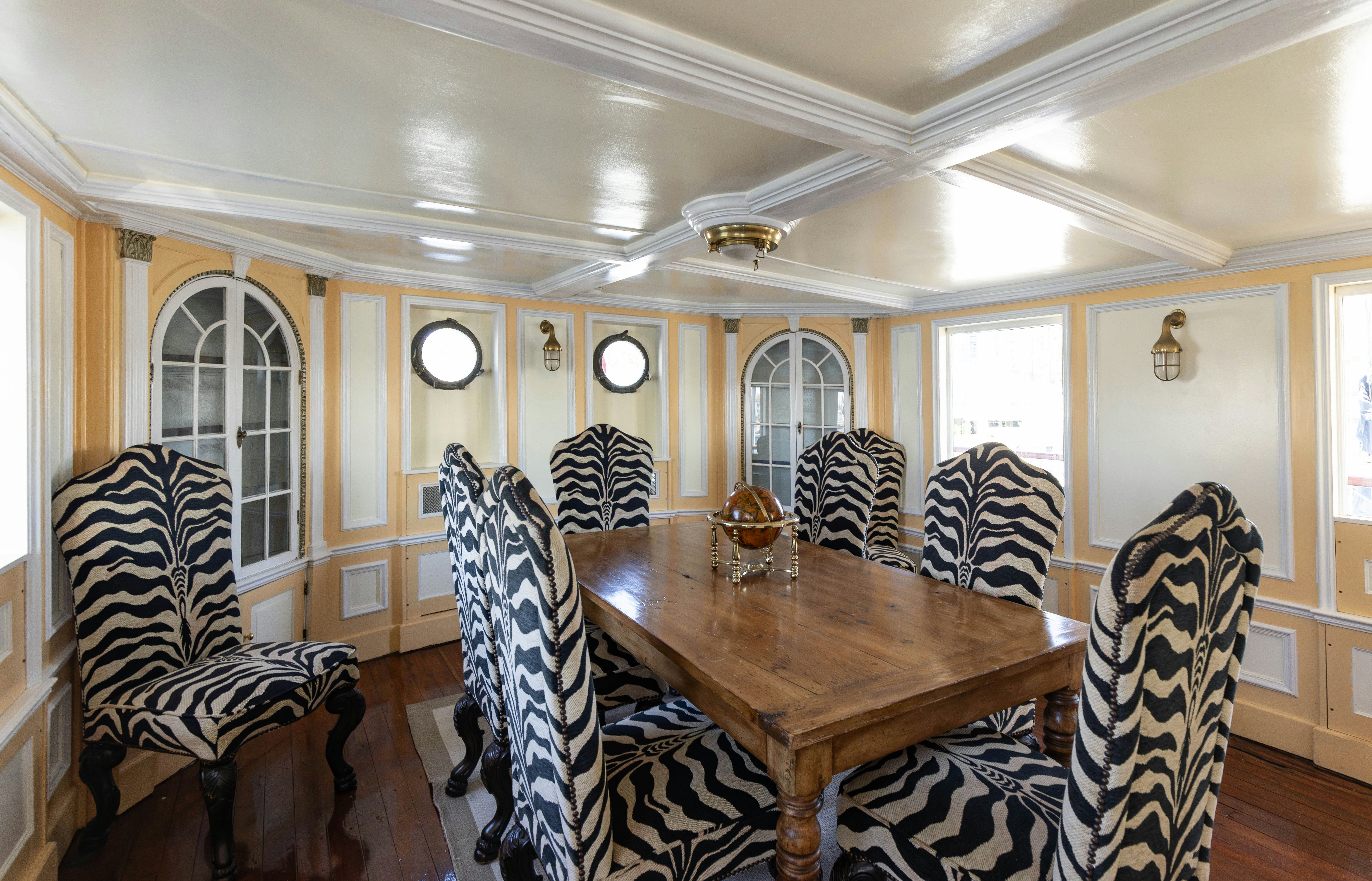a dining room with chairs aboard NORTHWIND Yacht for Sale