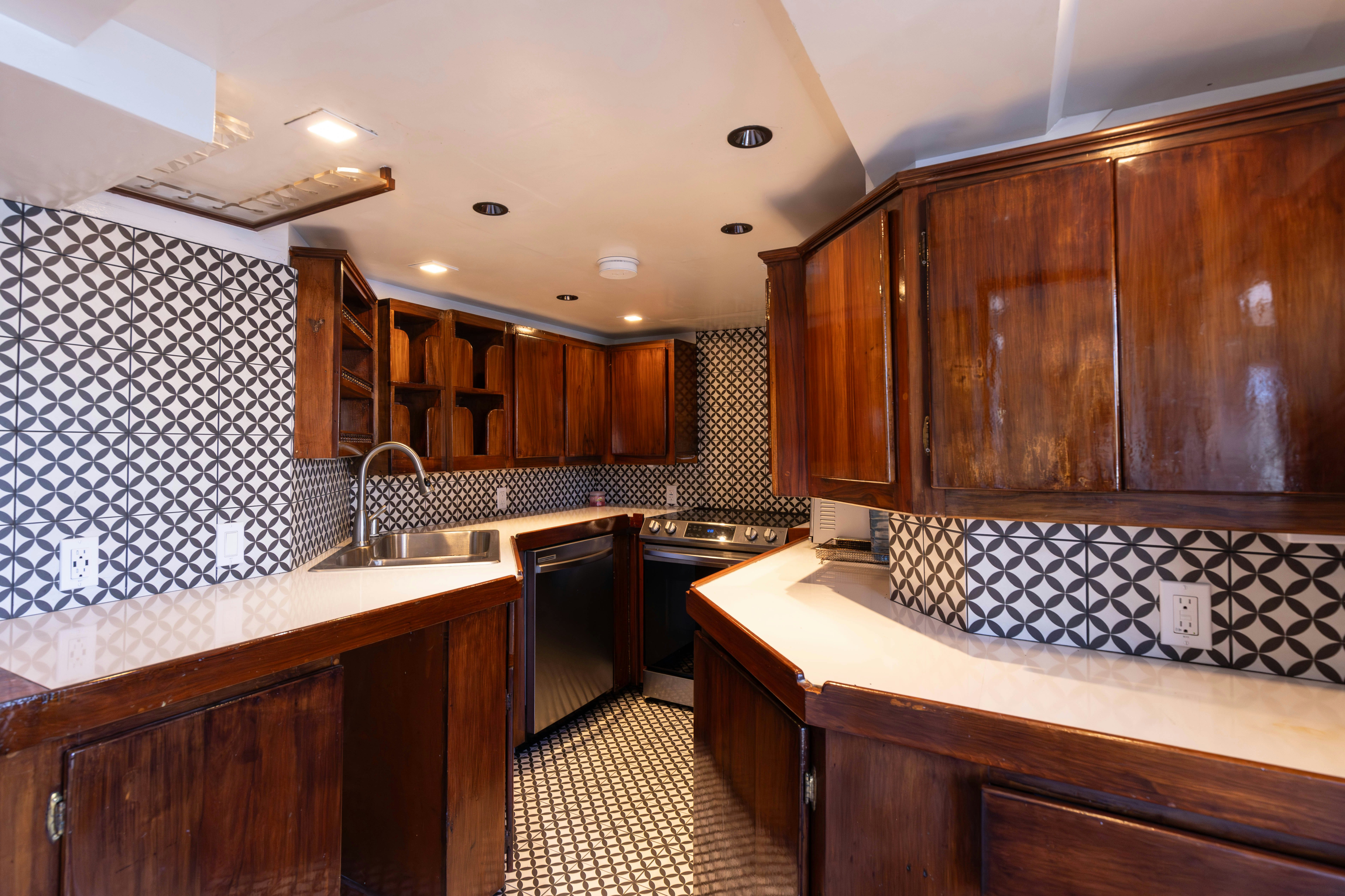 a kitchen with wooden cabinets aboard NORTHWIND Yacht for Sale